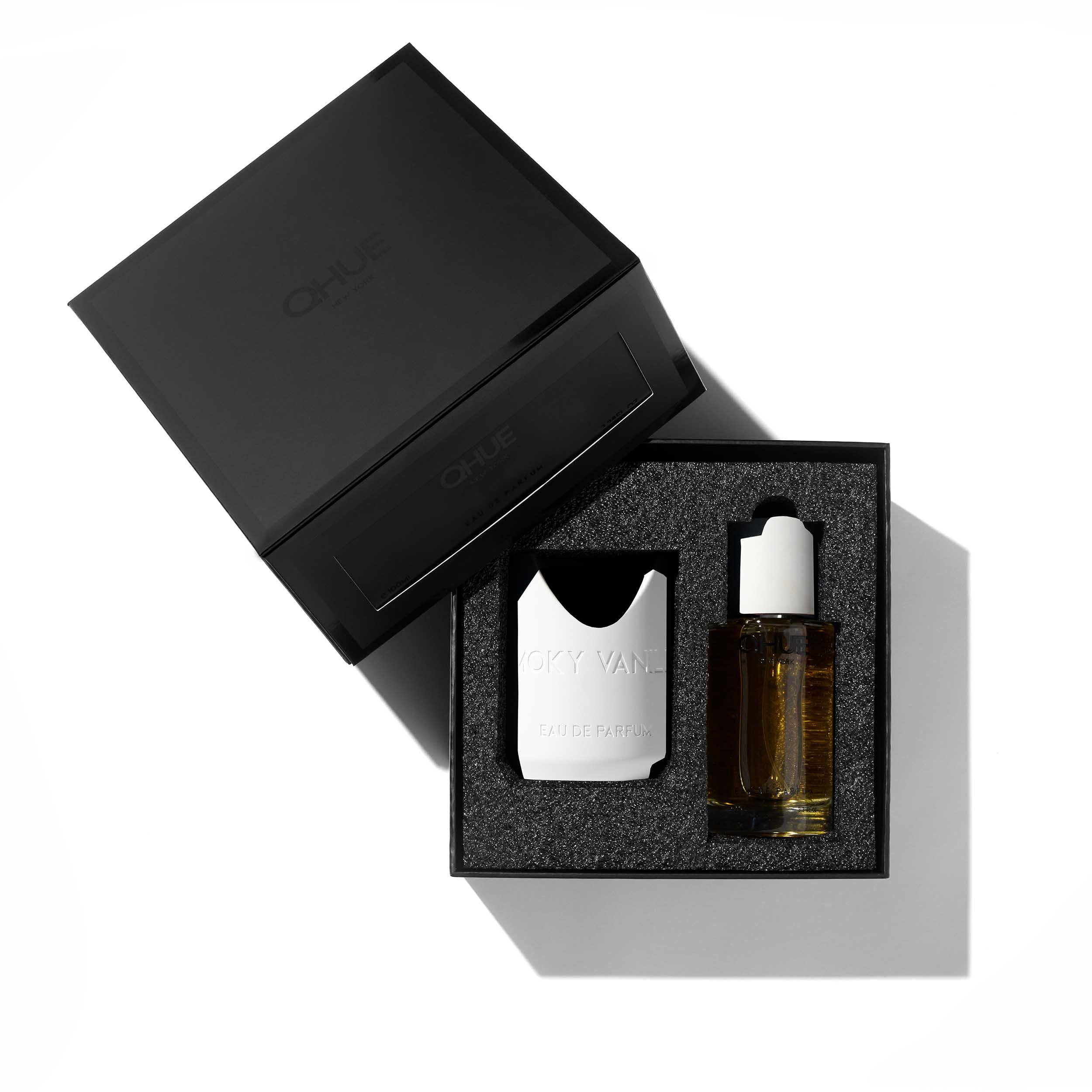 Qhue New York Smoky Vanilla Eau de Parfum gift box with fragrance bottle, and luxury black presentation box.