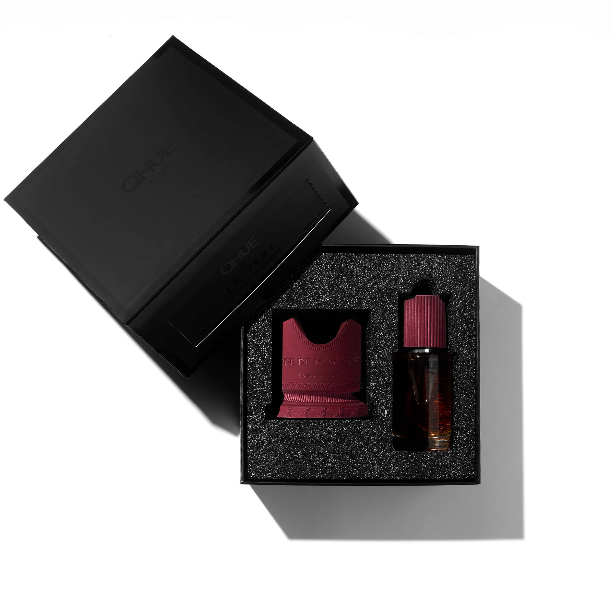 Ode de New York parfum bottle and refill presented in a matte-black Qhue New York box with custom foam tray.
