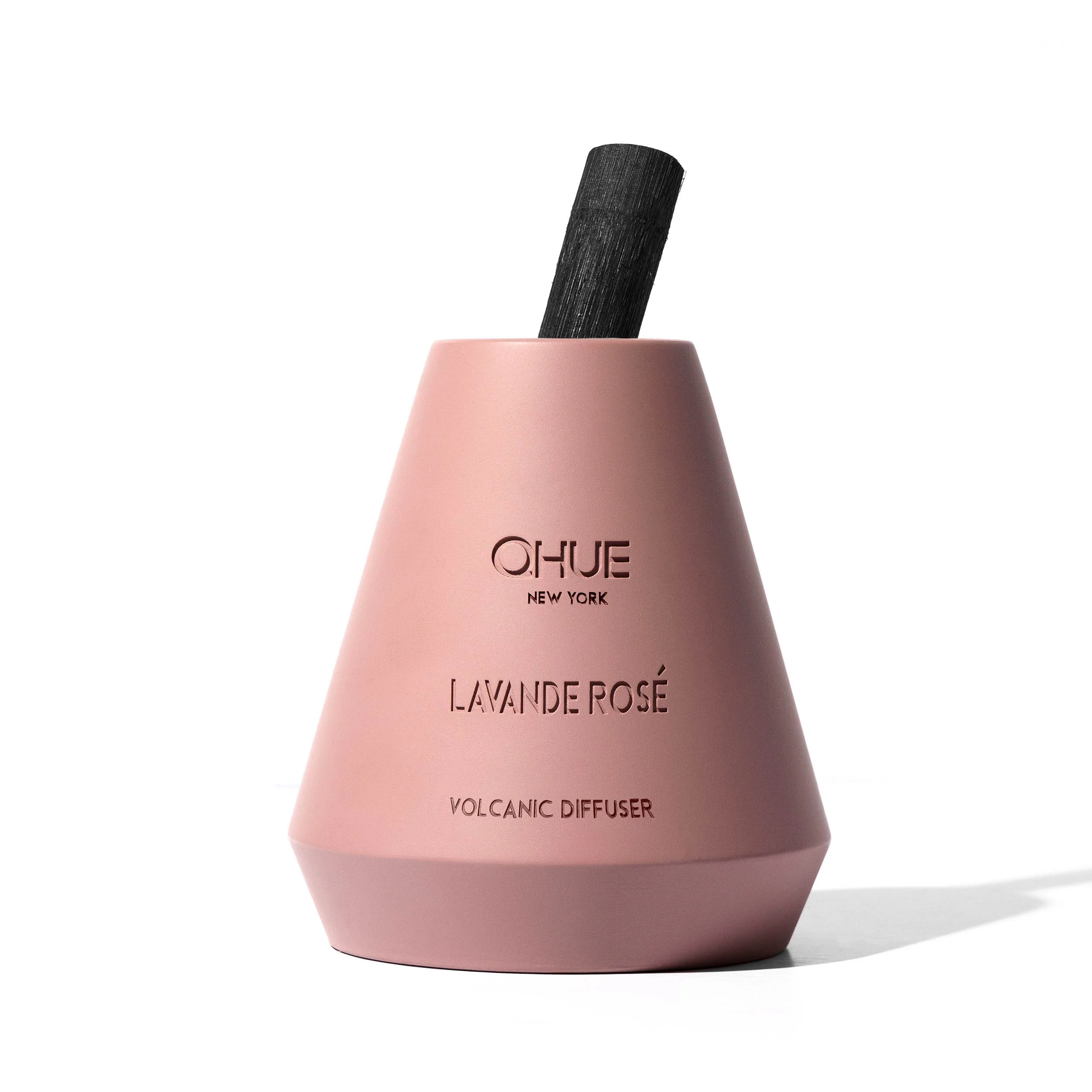 Qhue New York Lavande Rosé Volcanic Reed Diffuser in a hand-painted blush pink cement vessel with signature black bamboo reed.
