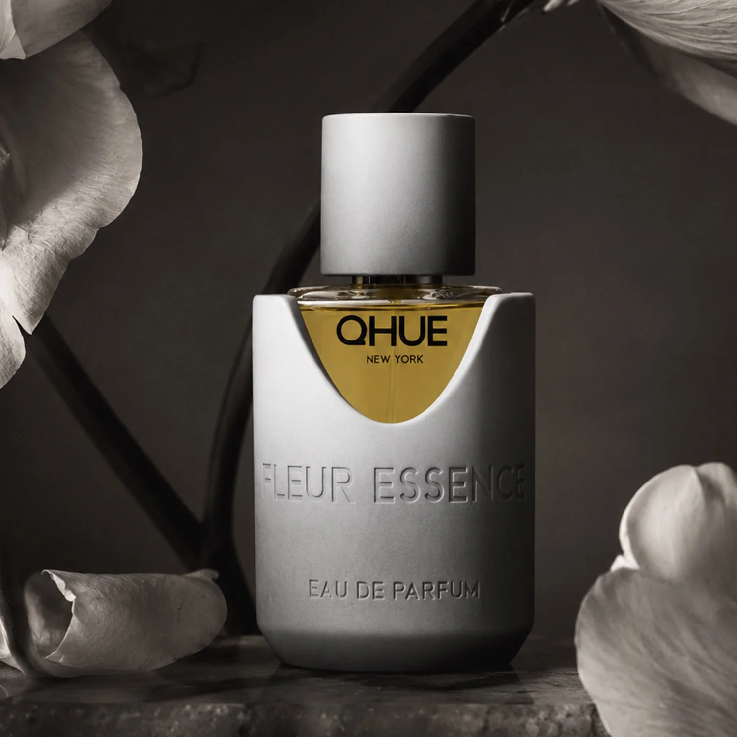 Qhue New York Fleur Essence Eau de Parfum luxury perfume featuring white peonies in an artistic monochrome campaign inspired by fine art floral photography.