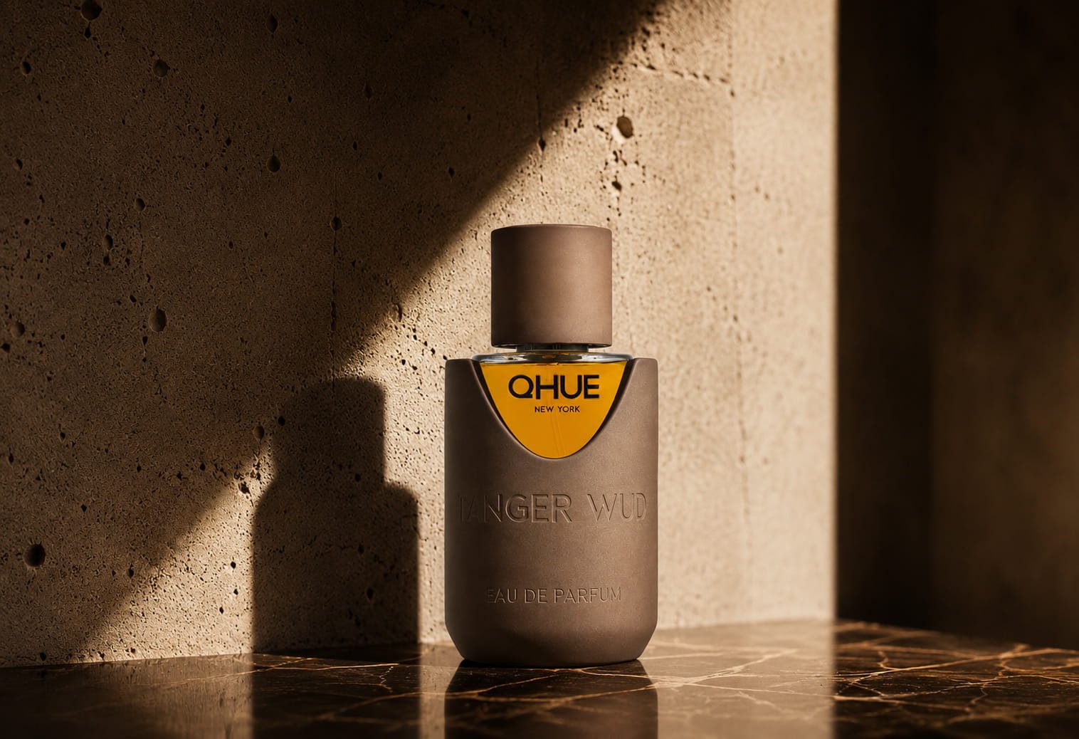 Tanger wud by Qhue New york in brown cement bottle
