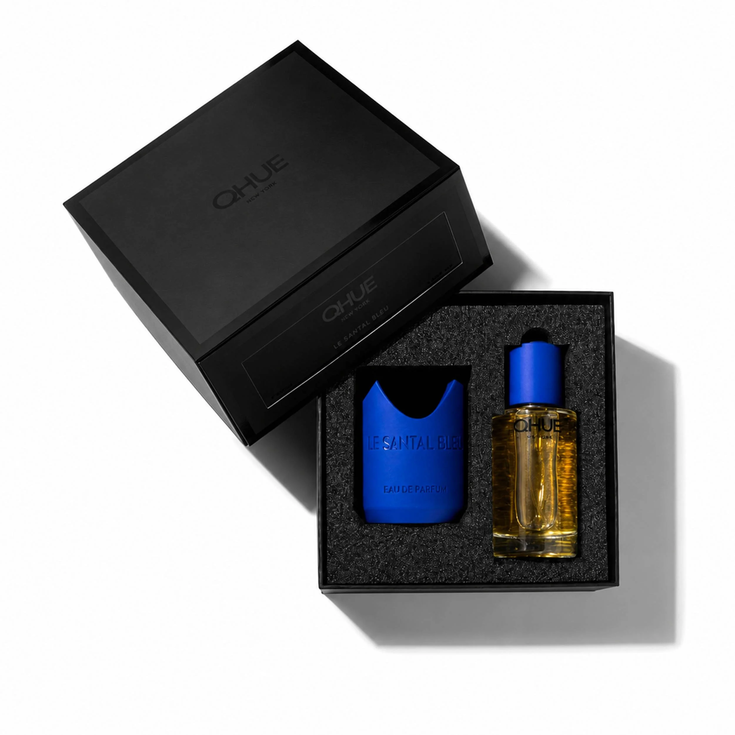 Qhue New York Le Santal Bleu Eau de Parfum gift set with fragrance bottle, and luxury black presentation box