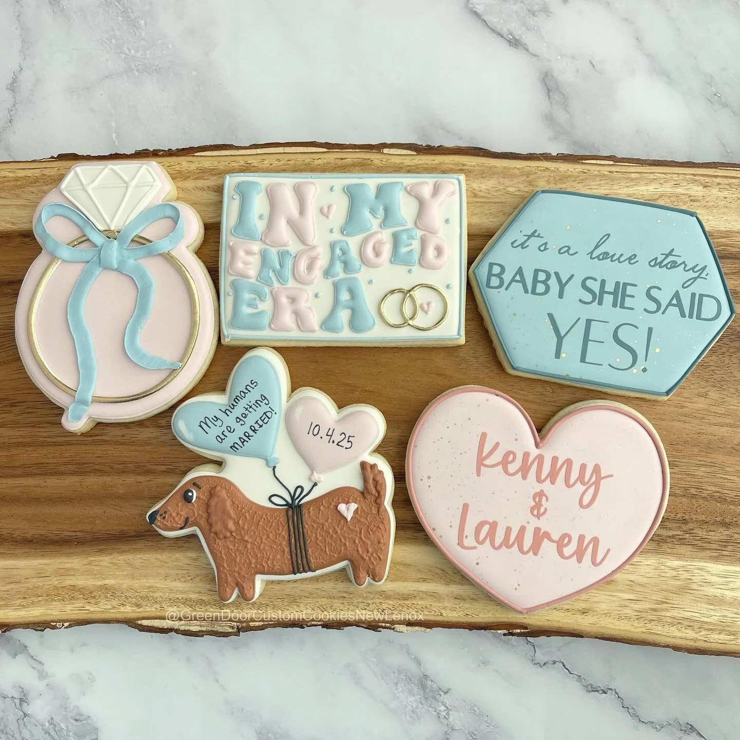 Congratulations on your engagement! 💍 🎉 

I loved incorporating a love for Taylor Swift along with their adorable dog to the designs. It&rsquo;s what makes this job a good time. 🤩 

#greendoorbakerynewlenox #newlenox #newlenoxil #newlenoxillinois 