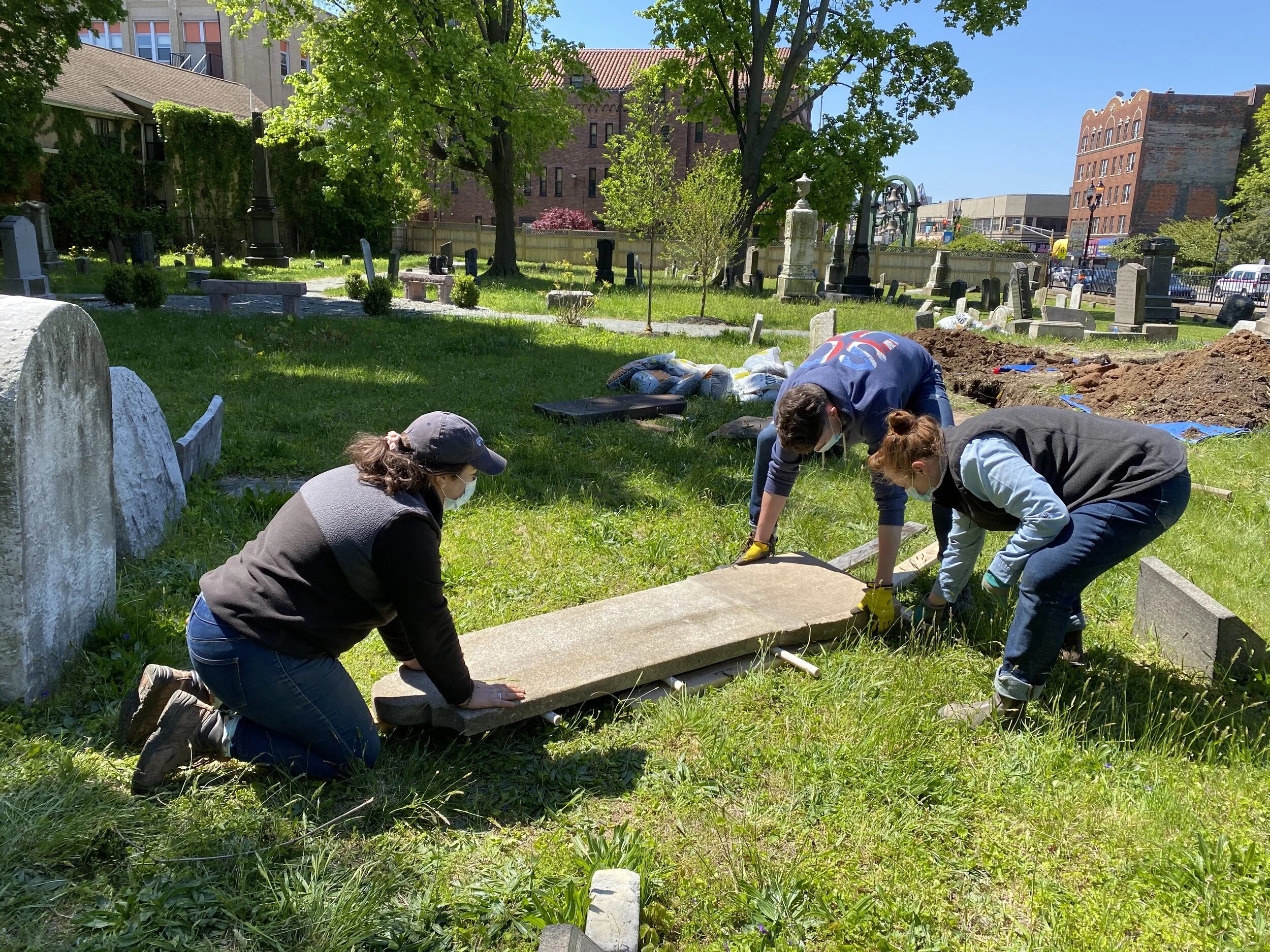 Resetting a cemetery marker after repairs