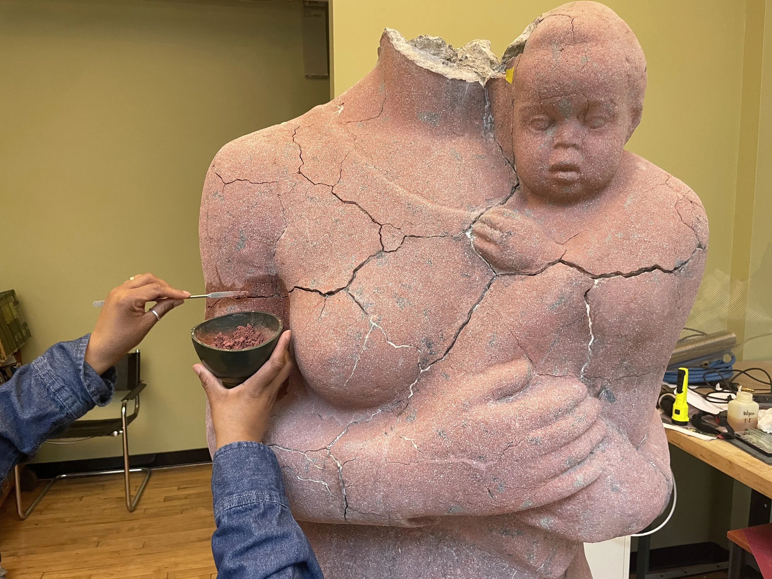 Patching cracks with composite material.