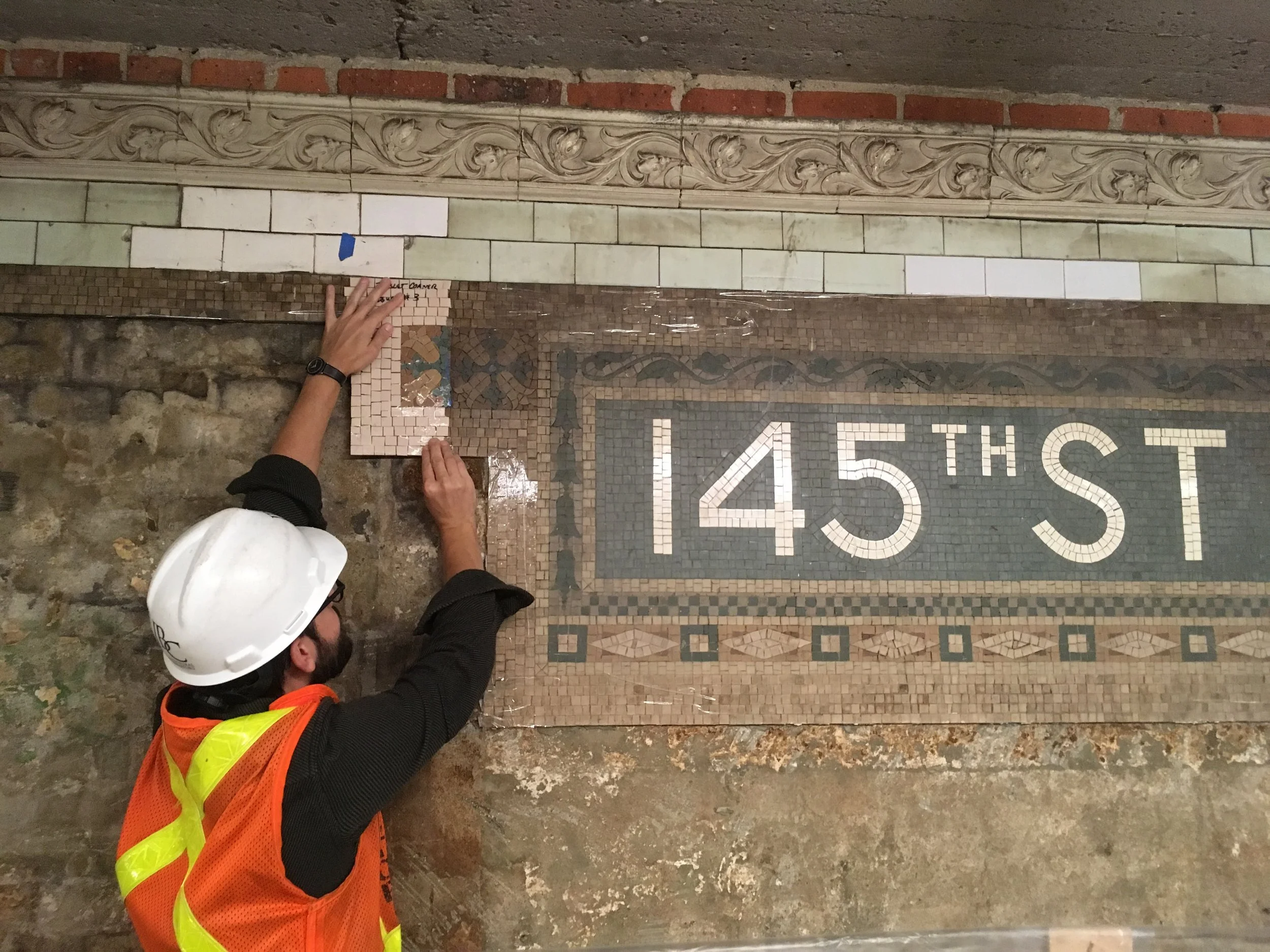 Reviewing a mosaic sample.