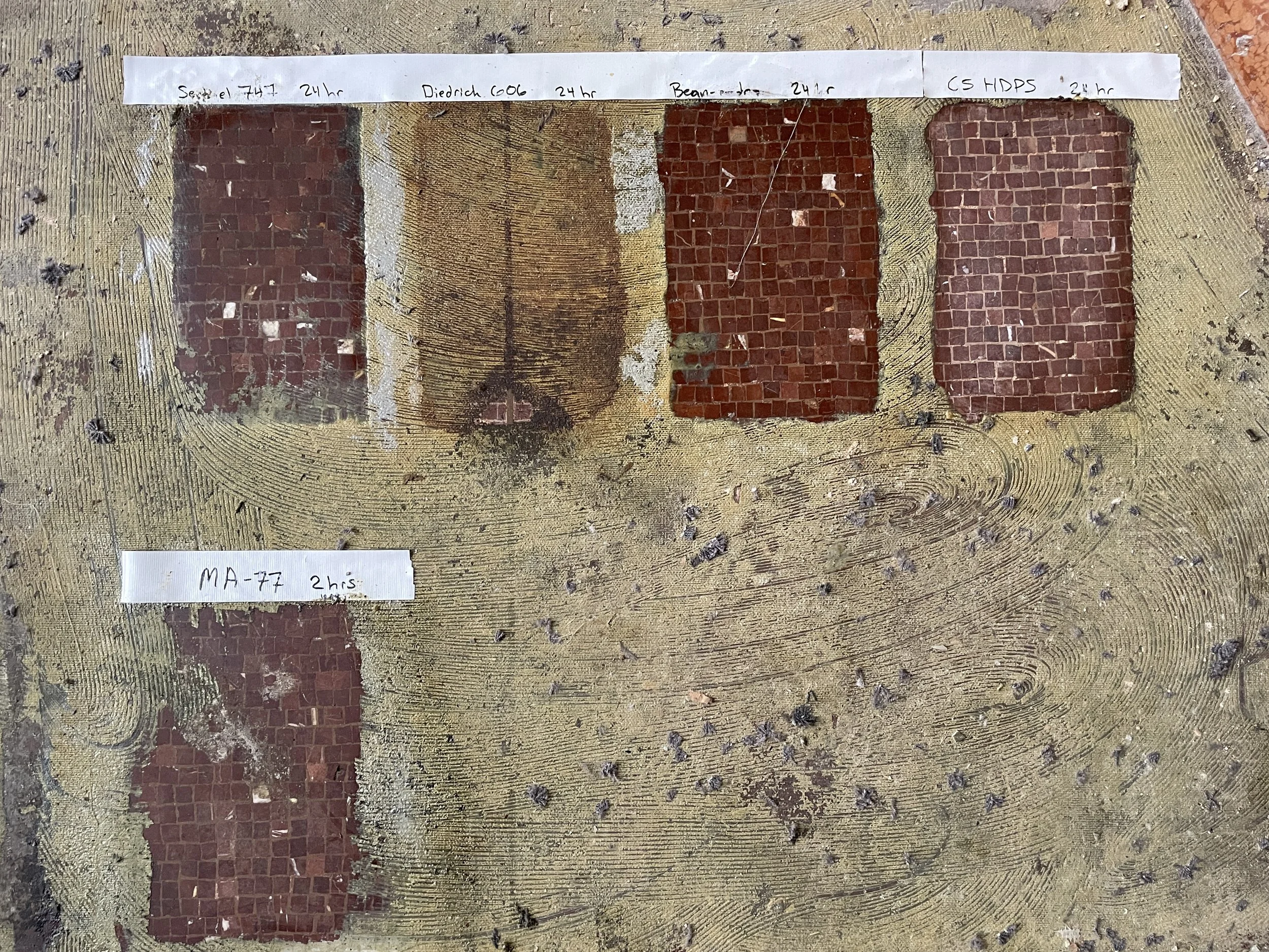 Cleaning test panels for removal carpet mastic from a mosaic tile floor.