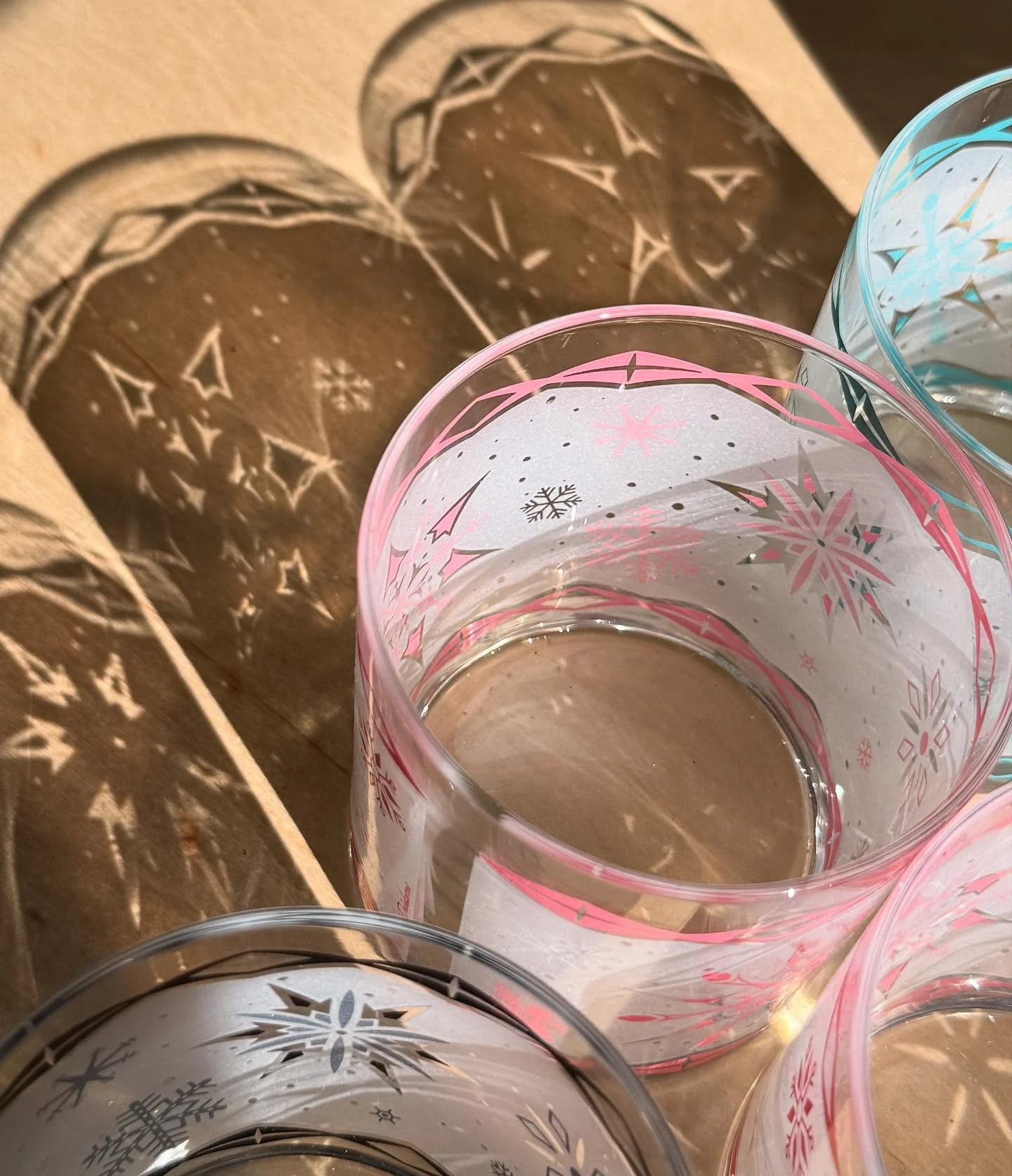 Pretty shot from the packing table today with the sun shining through Frosty Flakes Atomic Drinkware. ☀️❄️✨