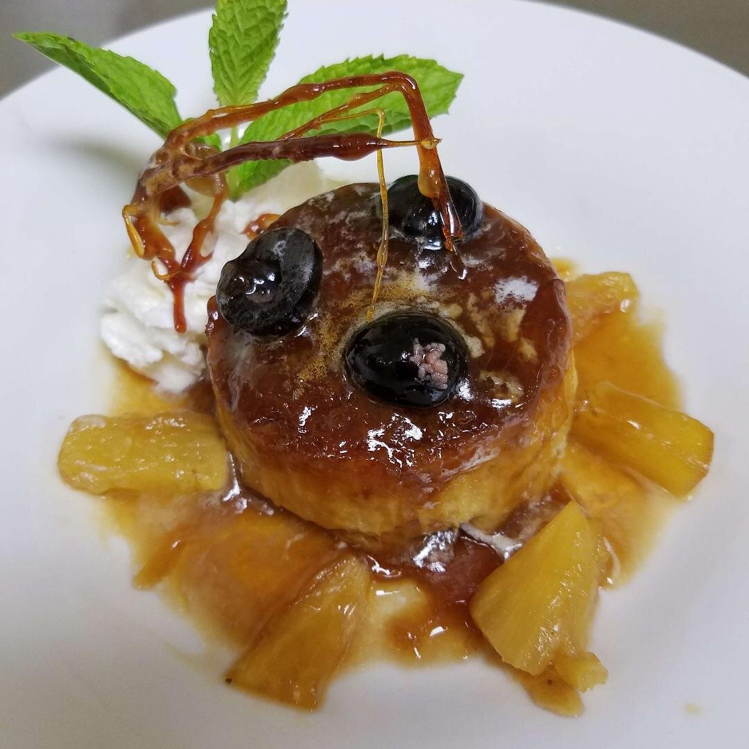 Pineapple upside down bread pudding, Luxardo cherry, and caramel tweel.