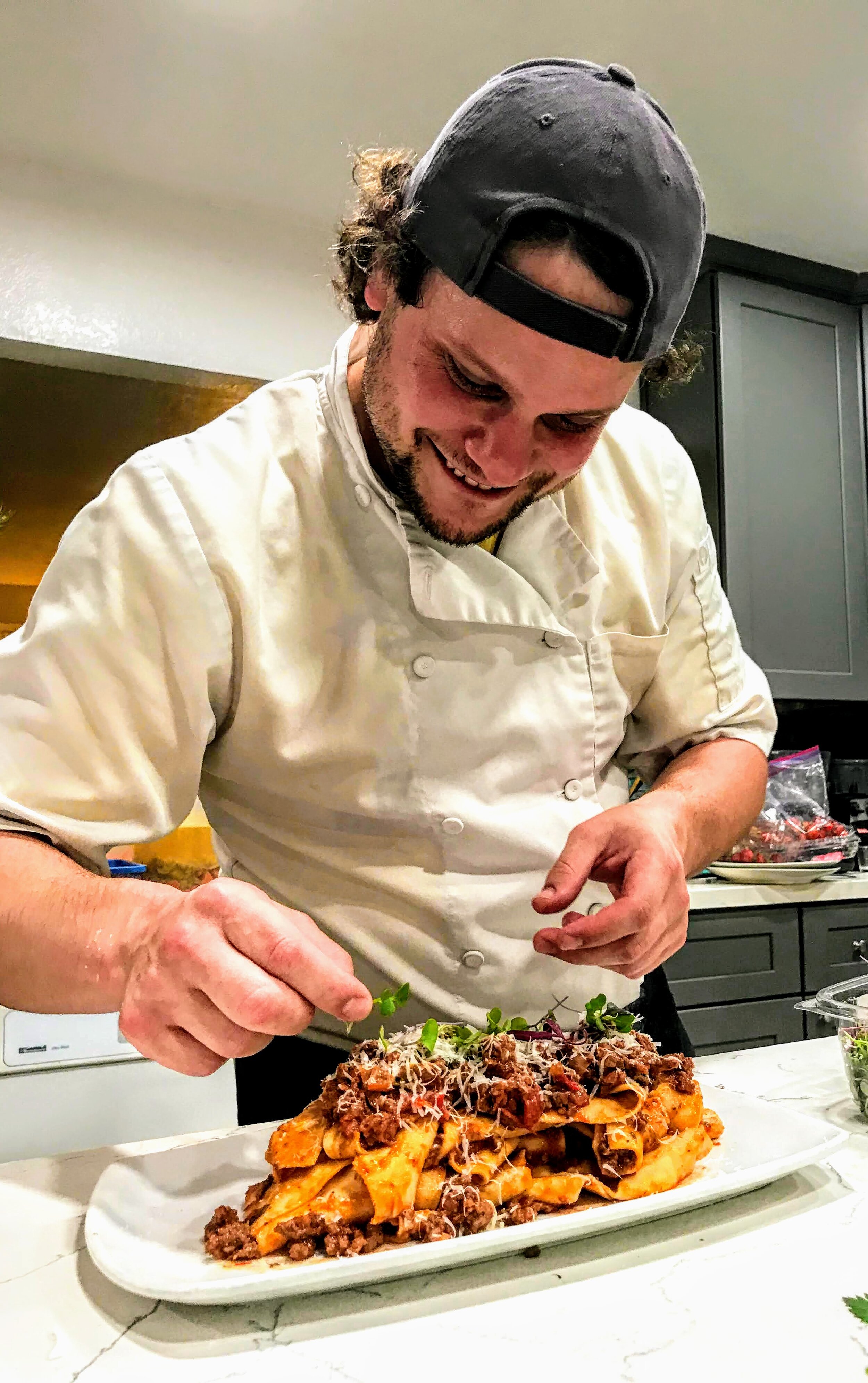 Chef Jared Desind, fresh pappardelle pasta, bolognese meat sauce, and pecorino romano.