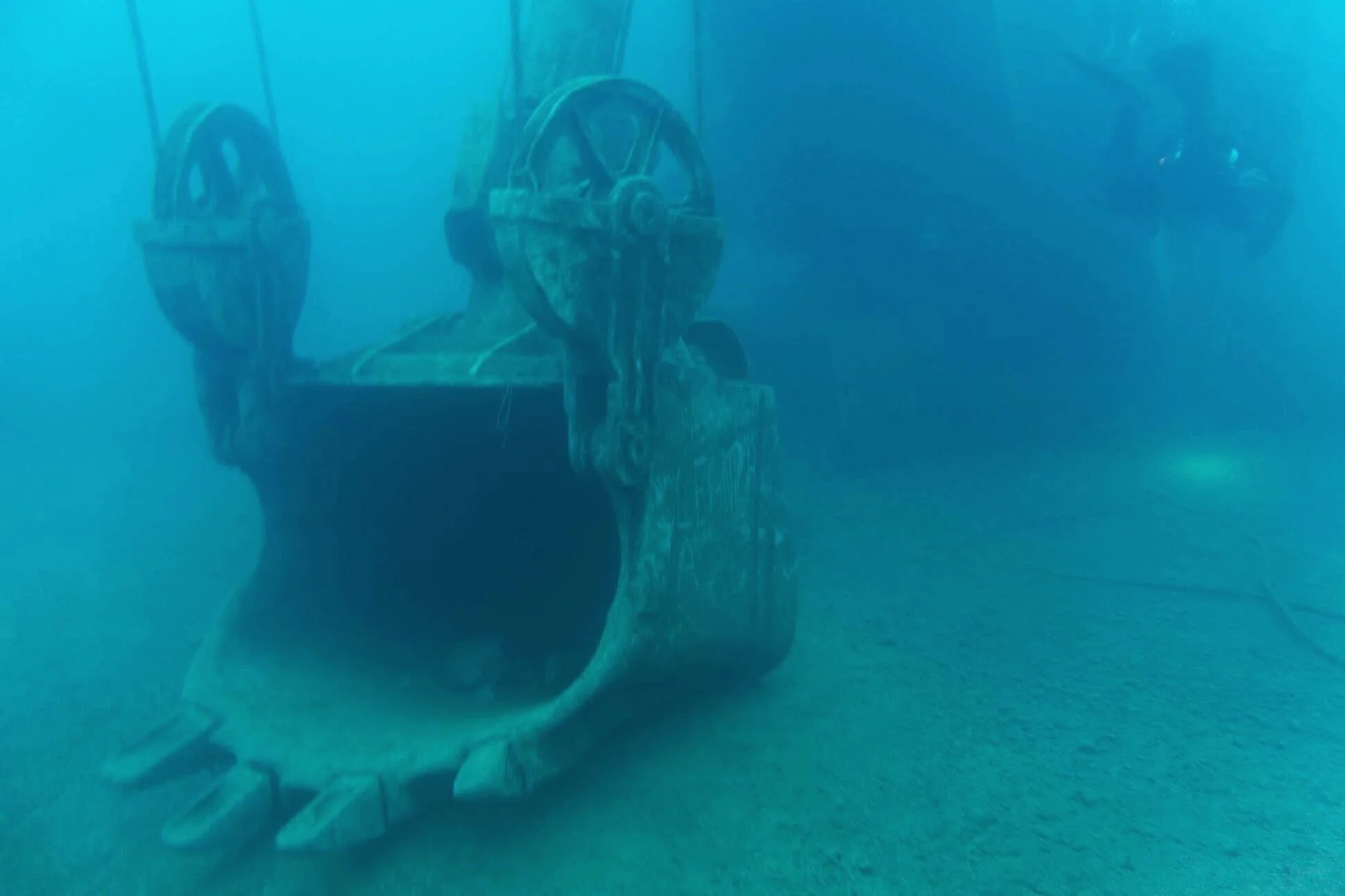 Scuba diving abandoned crane in ocean