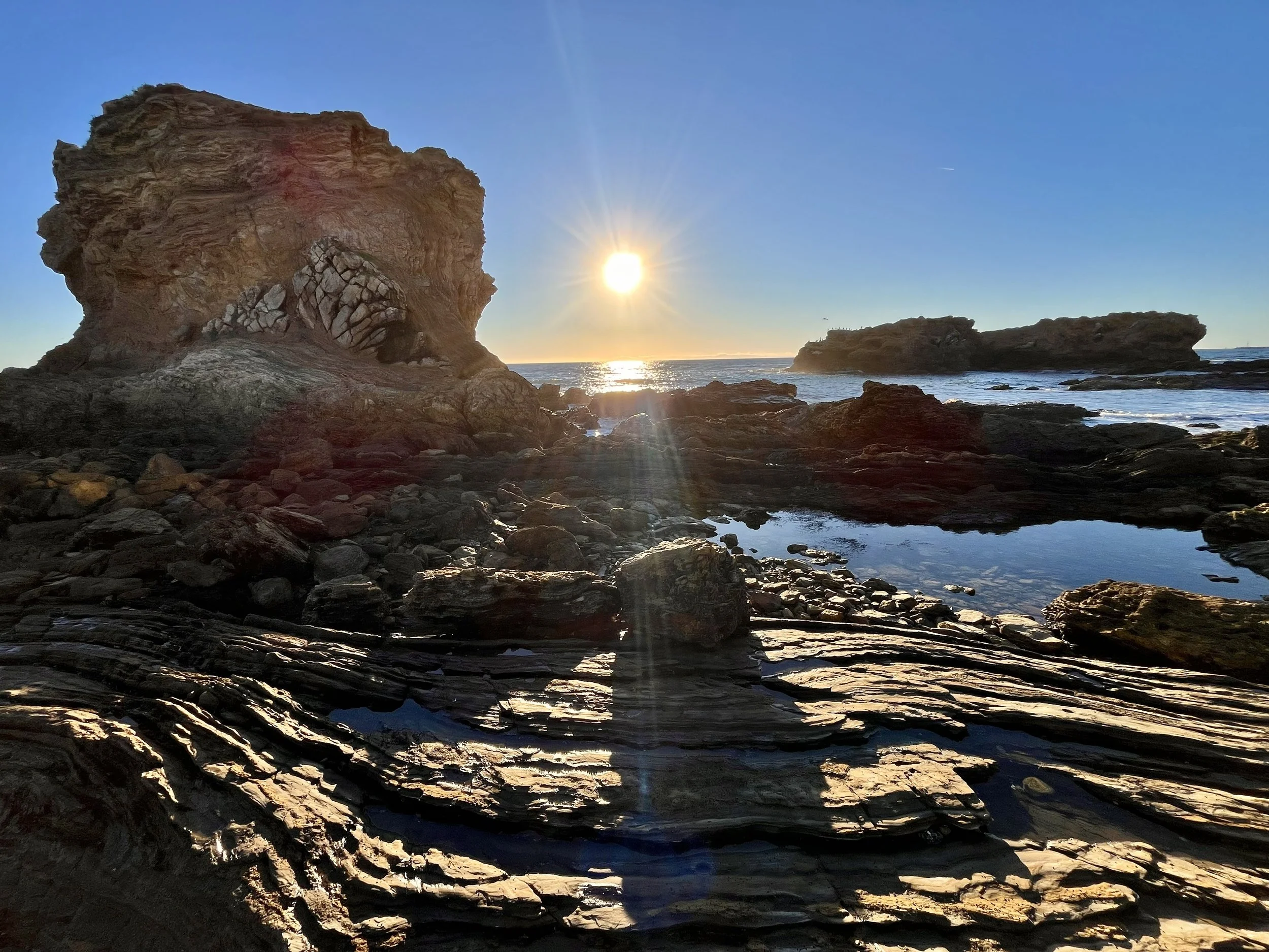 Newport Beach sunset rocky shore view