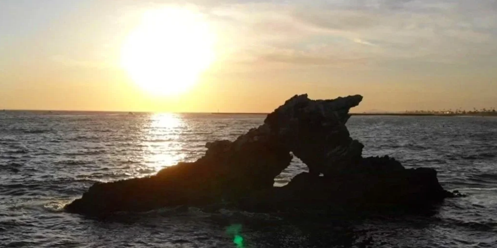 Arch Rock sunset of Newport Beach