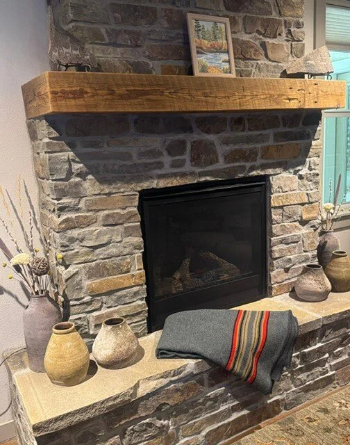 First Prize &middot; 2026  Annie Moessner  Using her rustic hearth as the focal point, Annie Moessner created an earthy, timeless space using our local artwork ("petroglyphs" from Spirits in Stone, artwork by Sheilla Dunn) and handmade ceramic jars.