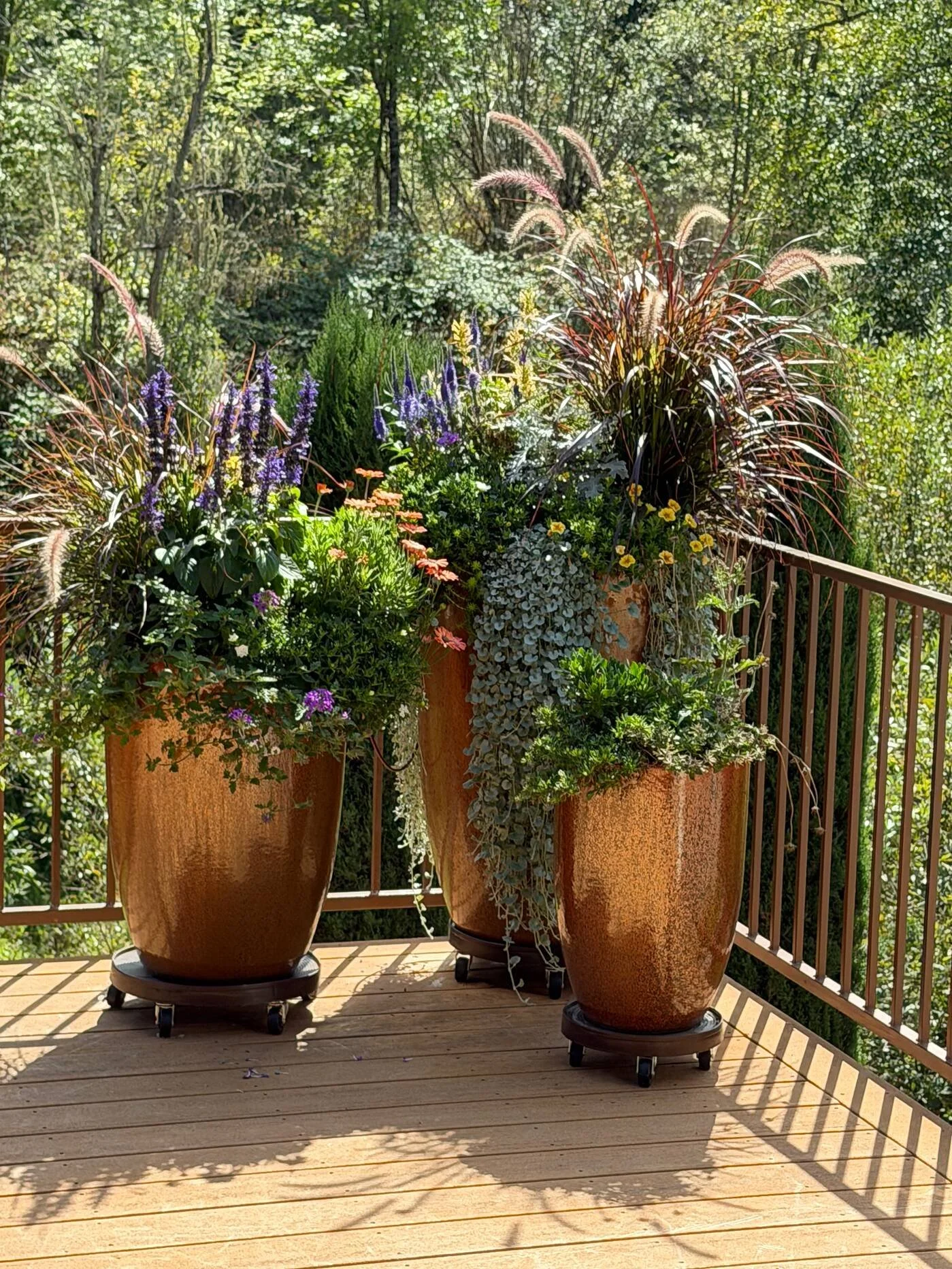  First Prize &middot; 2026  Wendy Laudette  Wendy Laudette chose a trio of our columnar Metallic Bronze planters to showcase her elegant planting arrangements. We're honored you tracked us down all the way from the Willamette Valley. Thanks for submi