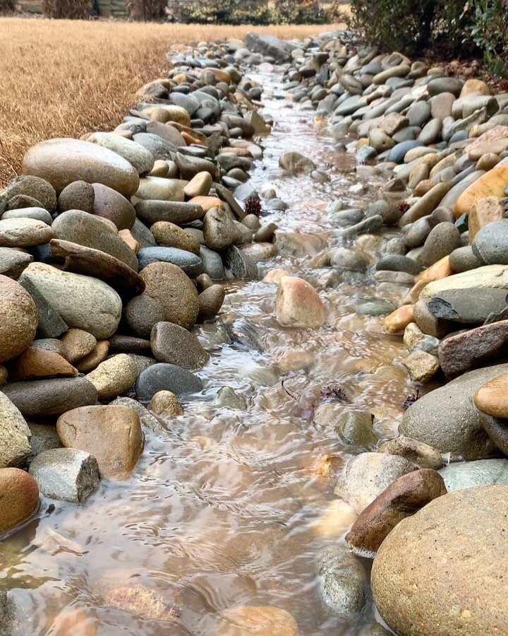 DRY CREEK BED:

Check out our recent project in action. This drainage solution redirected all the water around the property and off site via a dry creek bed.  These creek beds can easily handle large amounts of water