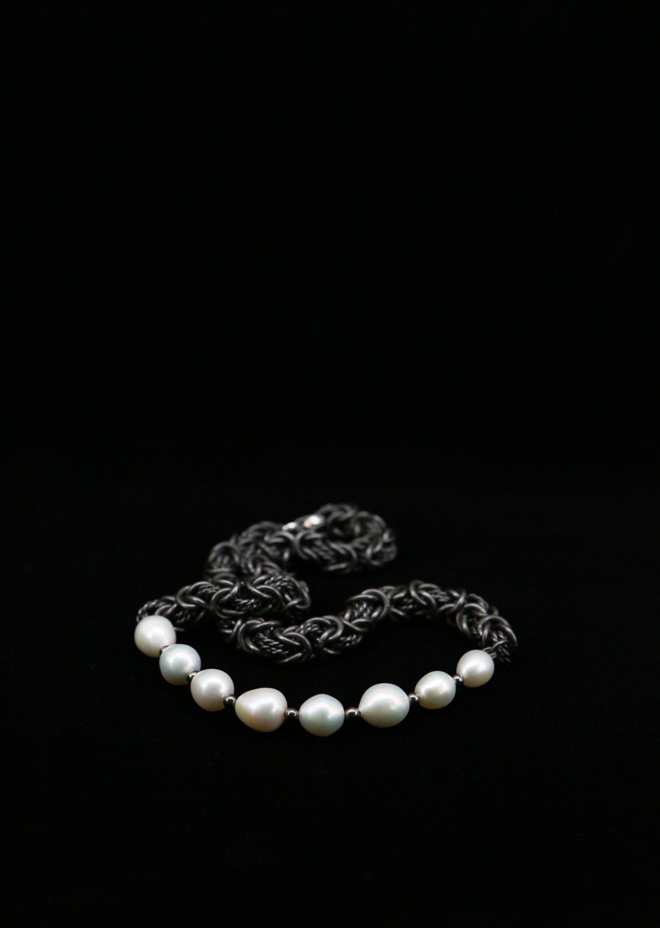 Gi by Giselle Dew Necklace, front view of natural Baroque pearls on titanium Byzantine chain