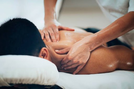 Man receiving a massage at Mainway Physiotherapy Clinic in Burlington.