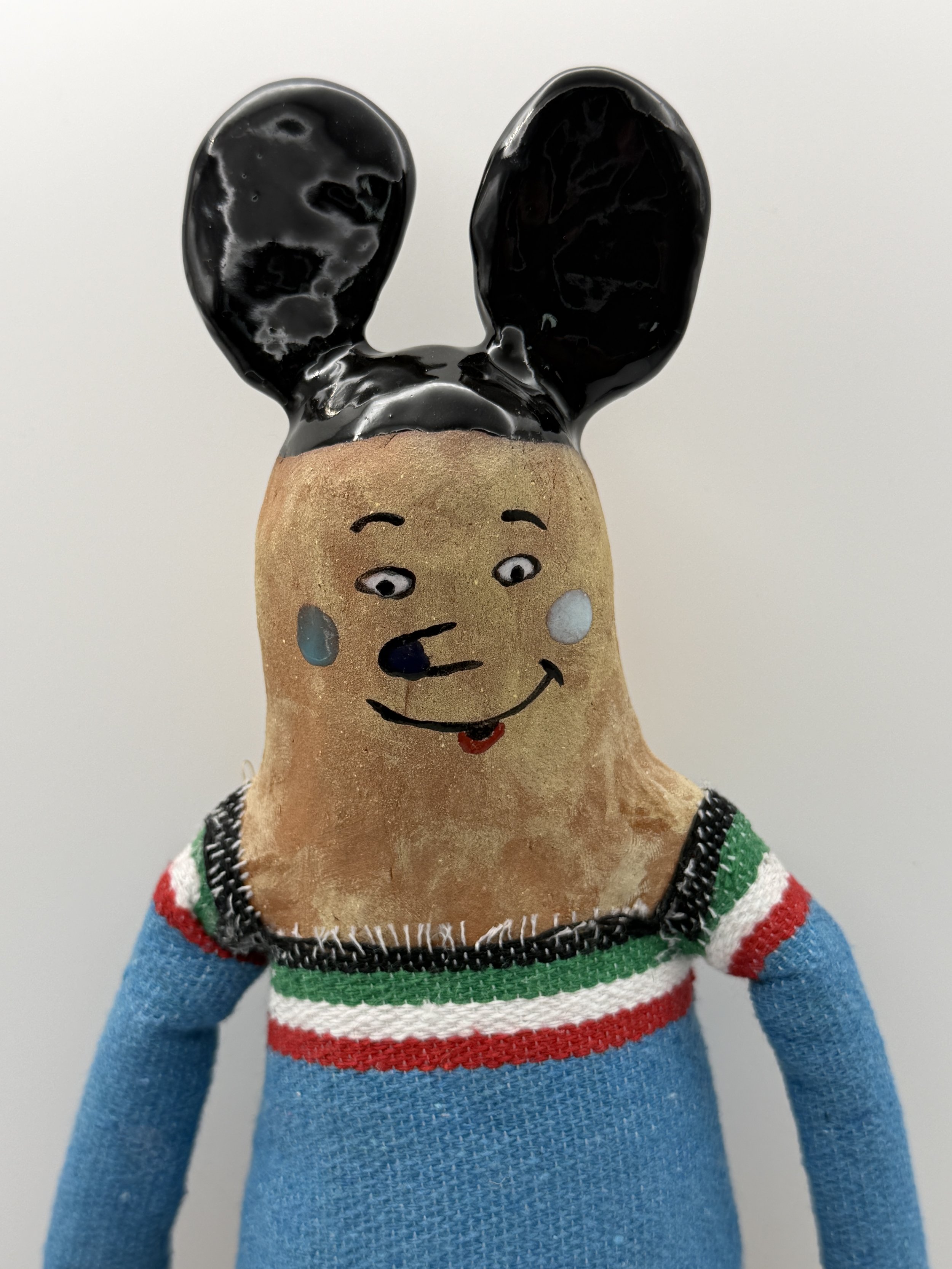 SOY UN ADULTO (I am an adult/ detail), glazed ceramic, sarape fabric) 14" x 6" x 3", 2026