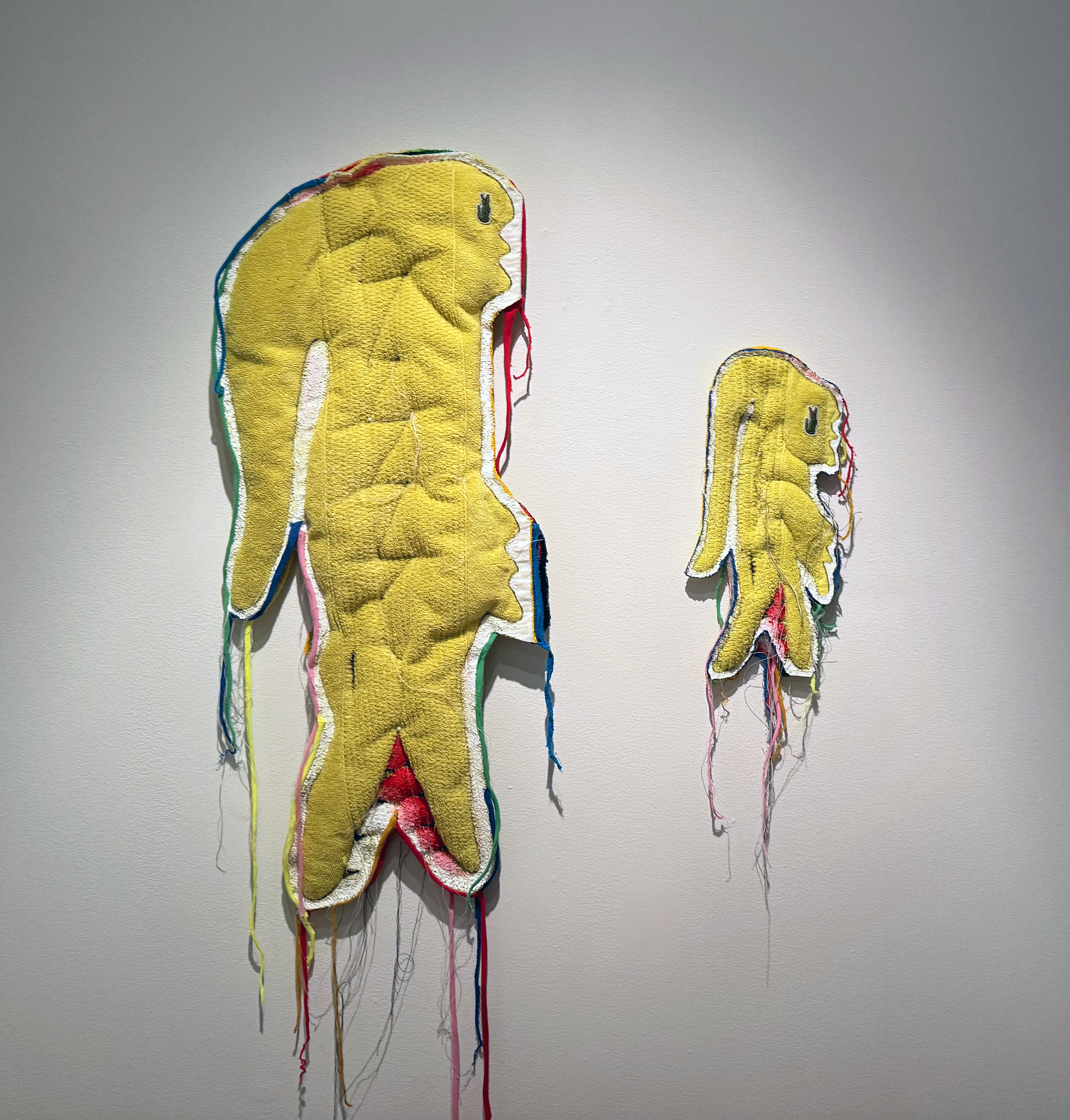 Father & Son, repurposed Lacoste towels, fabric, thread, acrylic paint, 2023