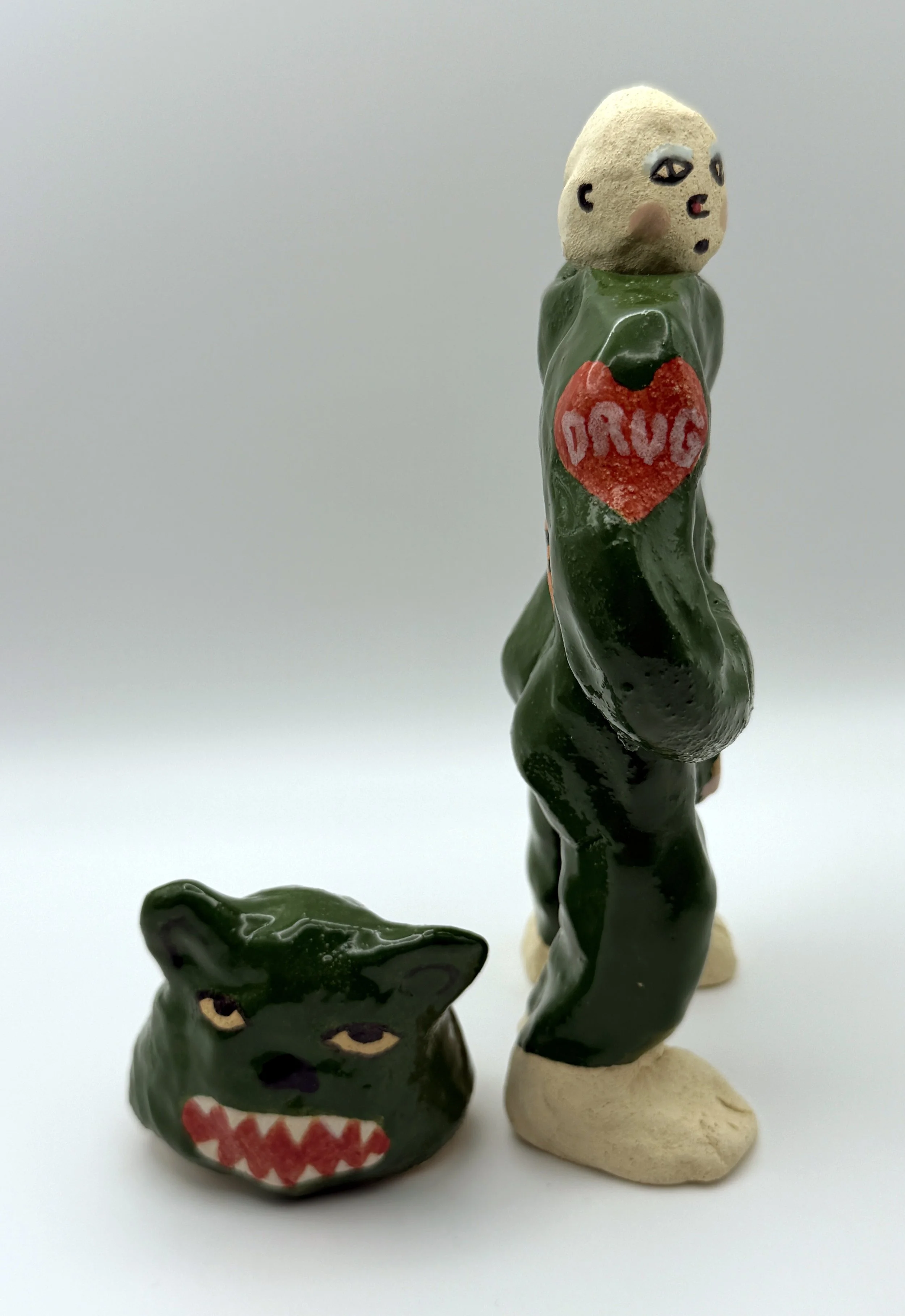 DRUG DEALER, glazed & bisque ceramic, 7.5” x 5” x 2”, 2026        
