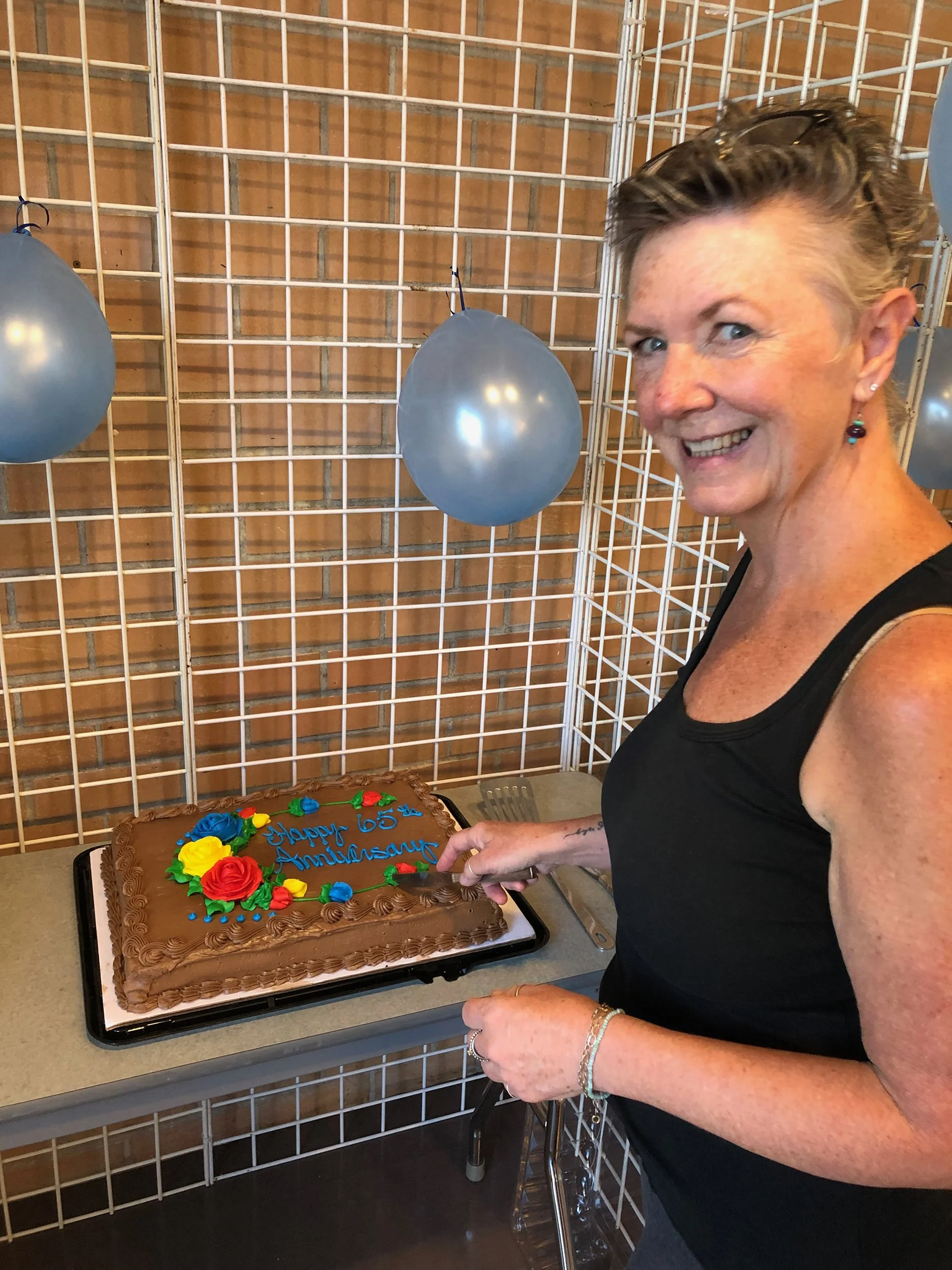 SLAA President, Kathleen Kelly cuts cake