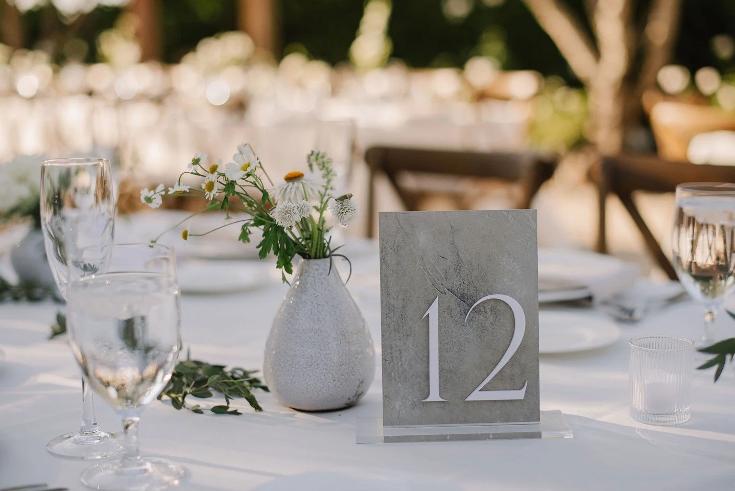 Custom stone textured table numbers designed to complement your wedding aesthetic 🌿 We&rsquo;re booking 2026 events and would love to be a part of your special day! Click the link in our bio to get started 🫶🏼⁠
⁠
Pictured: Custom textured table num