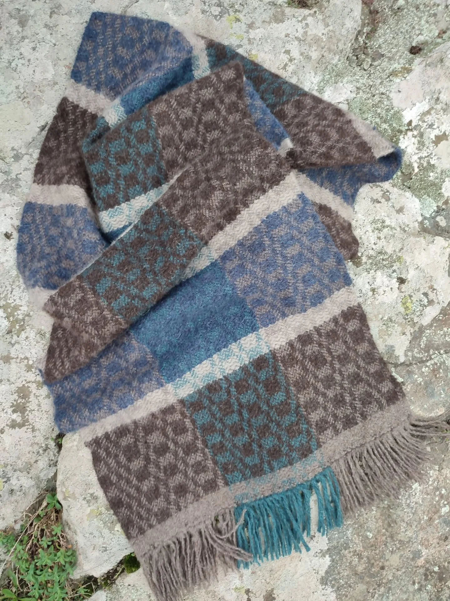 &bull; TIDE &amp; TOR &bull; 

A Blanket Scarf of beautiful British wool rare breeds, Jacob, Shetland and Blue-Faced Leicester. One of a kind, inspired by land and sea. 

&deg;The waters that divide us are the waters that connect us,
They shape the c