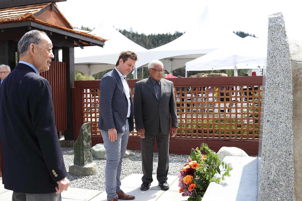 Minister Rob Fleming with internment survivors