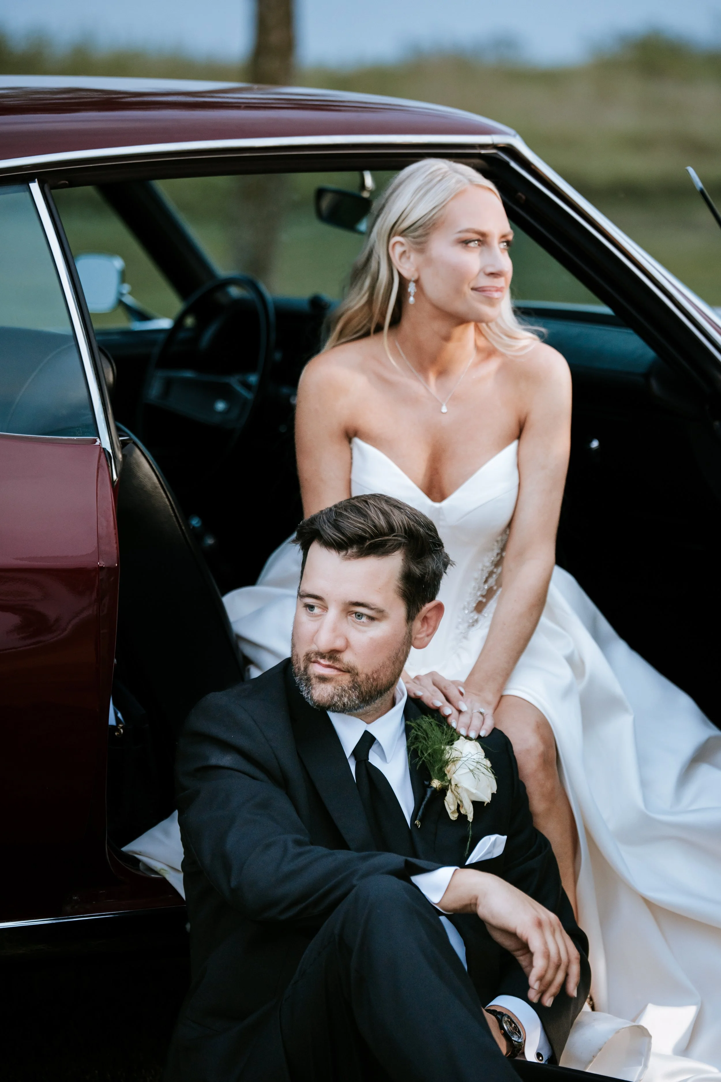 bride in groom in classic car