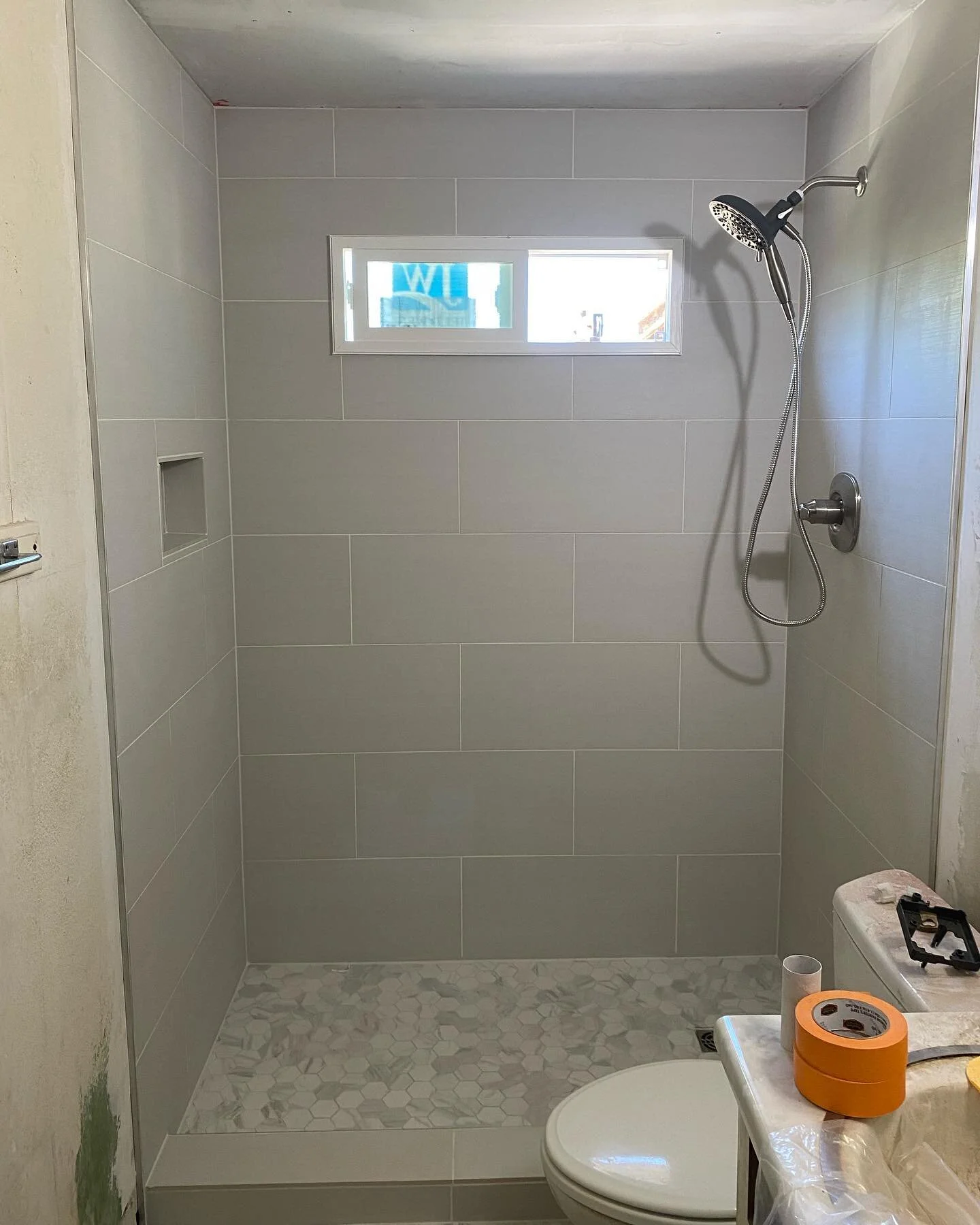 Swipe to see the before 👉🏼👉🏼 Recent shower remodel we did in Maryvale - Ripped out the old tub-shower, window, ceiling, and reframed the exterior due to water damage&hellip; Our client was stoked with the finished product, which is what makes thi