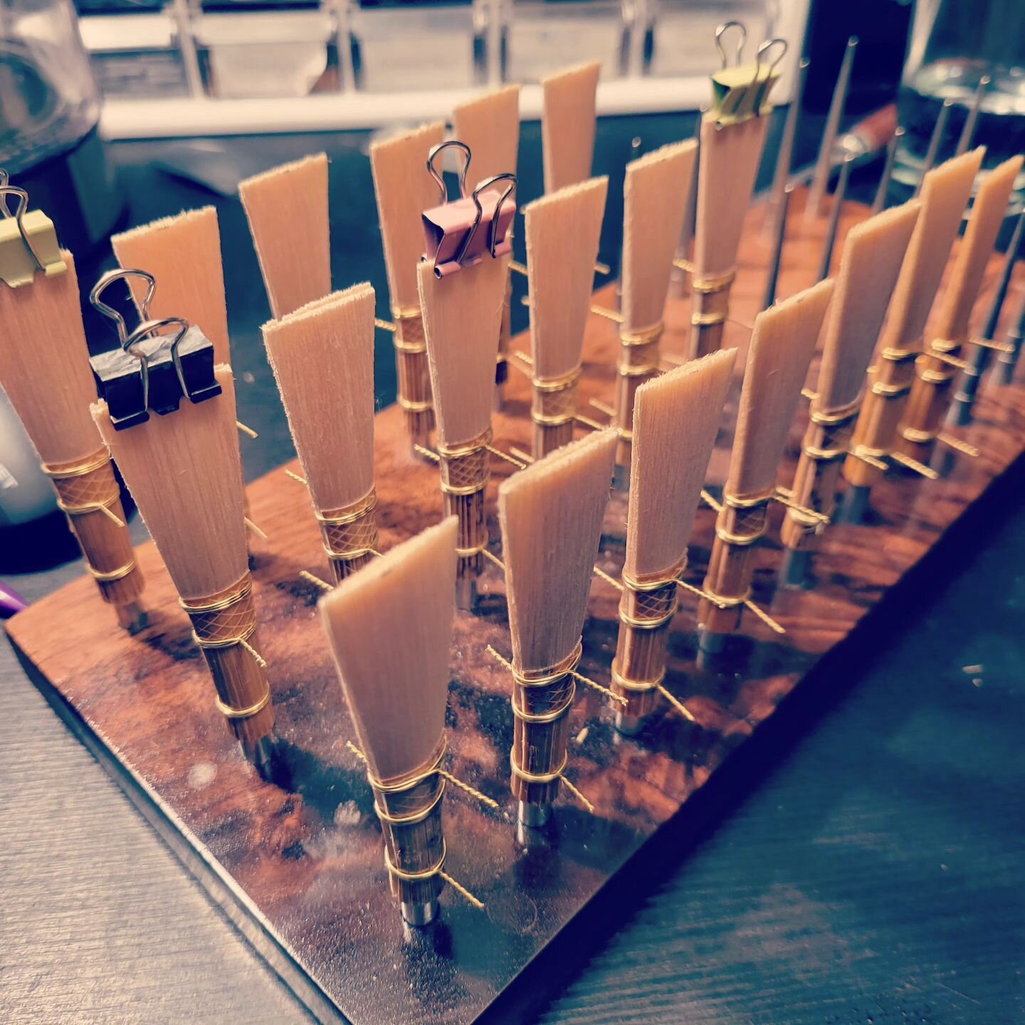 Another 19 contra reed blanks formed today... now my hands need a rest... and I'm out of contra cane!
Fun fact: I use exclusively 24 gauge brass wire on all of my reeds. I find anything thicker is not flexible enough, and therefore doesn't give muc