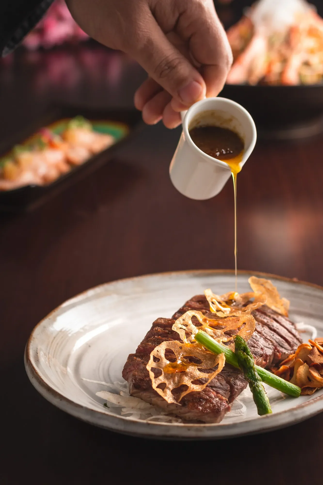 Detail shot of sirloin steak plating at a Japanese restaurant in Dubai