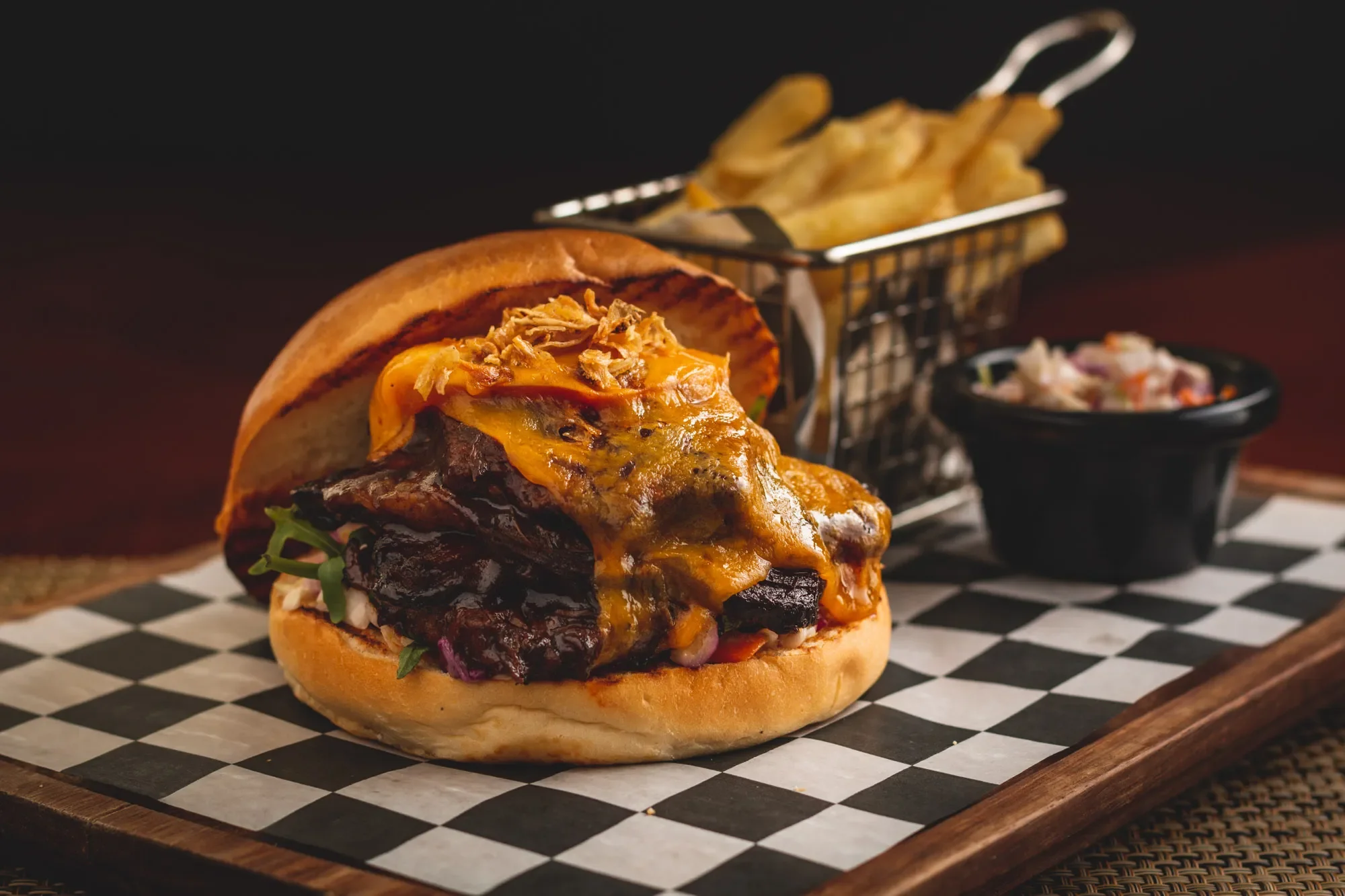 Presentation of a cheeseburger with fries at an Irish pub in Abu Dhabi