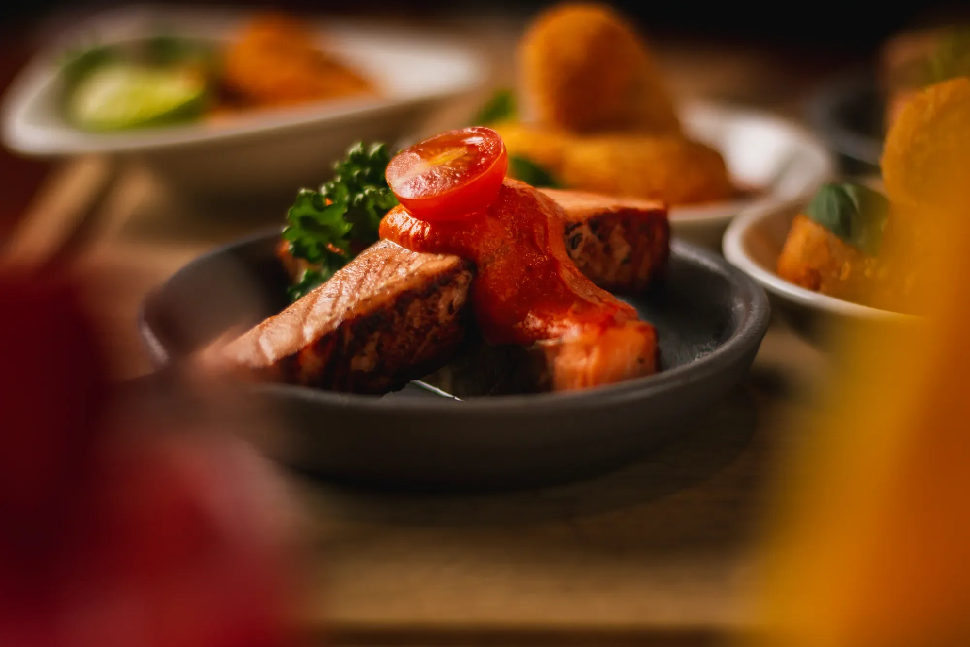 Close-up shot of a salmon dish at a luxury restaurant in Abu Dhabi