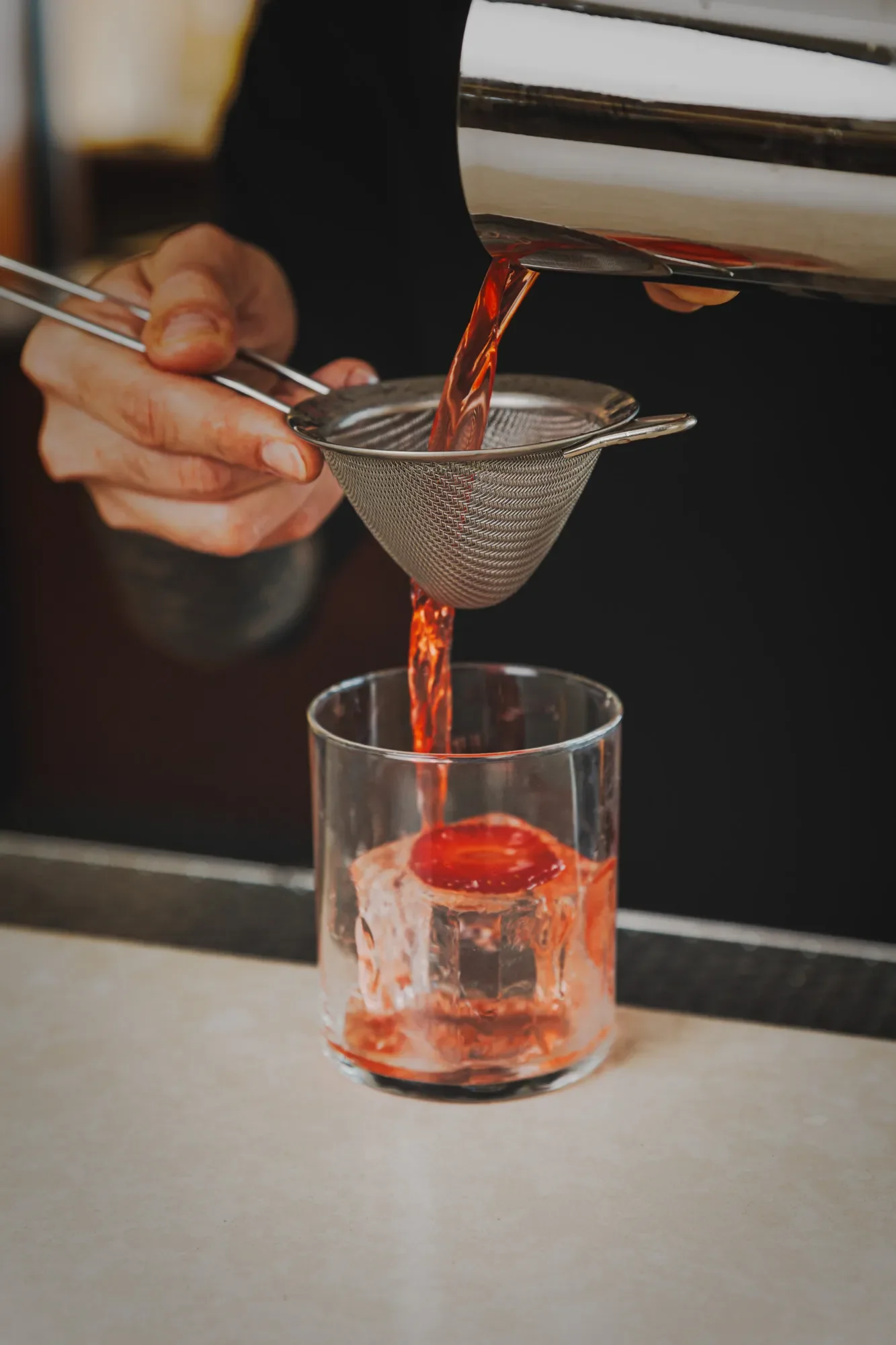 Preparation of a cocktail at a large hotel bar in Rethymno
