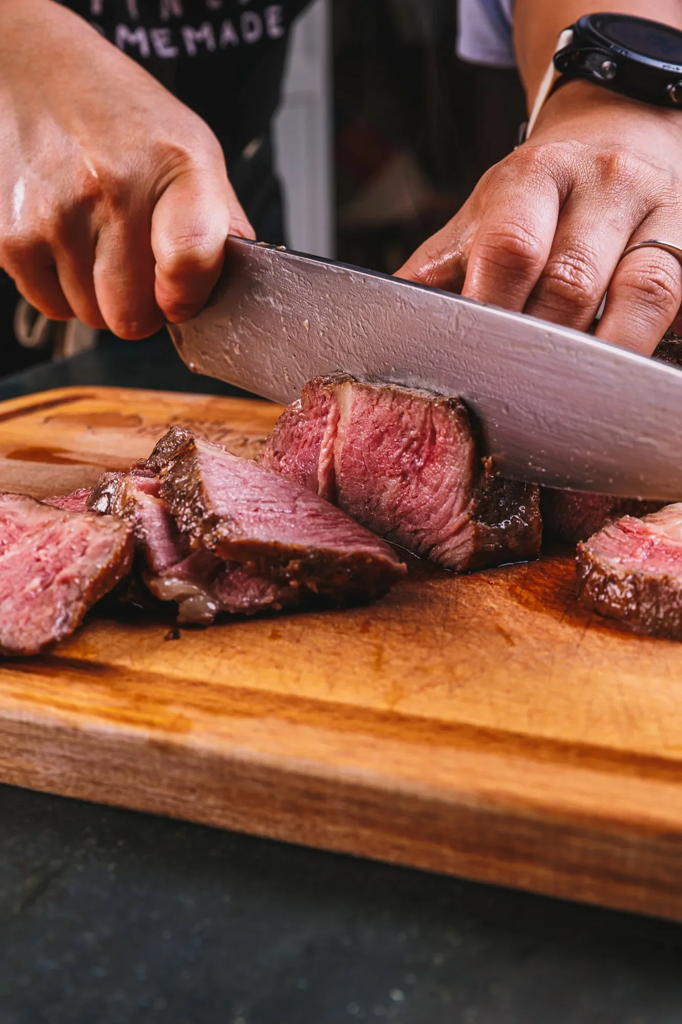 Slicing picanha for serving as part of a photoshoot for a recipe book in Abu Dhabi