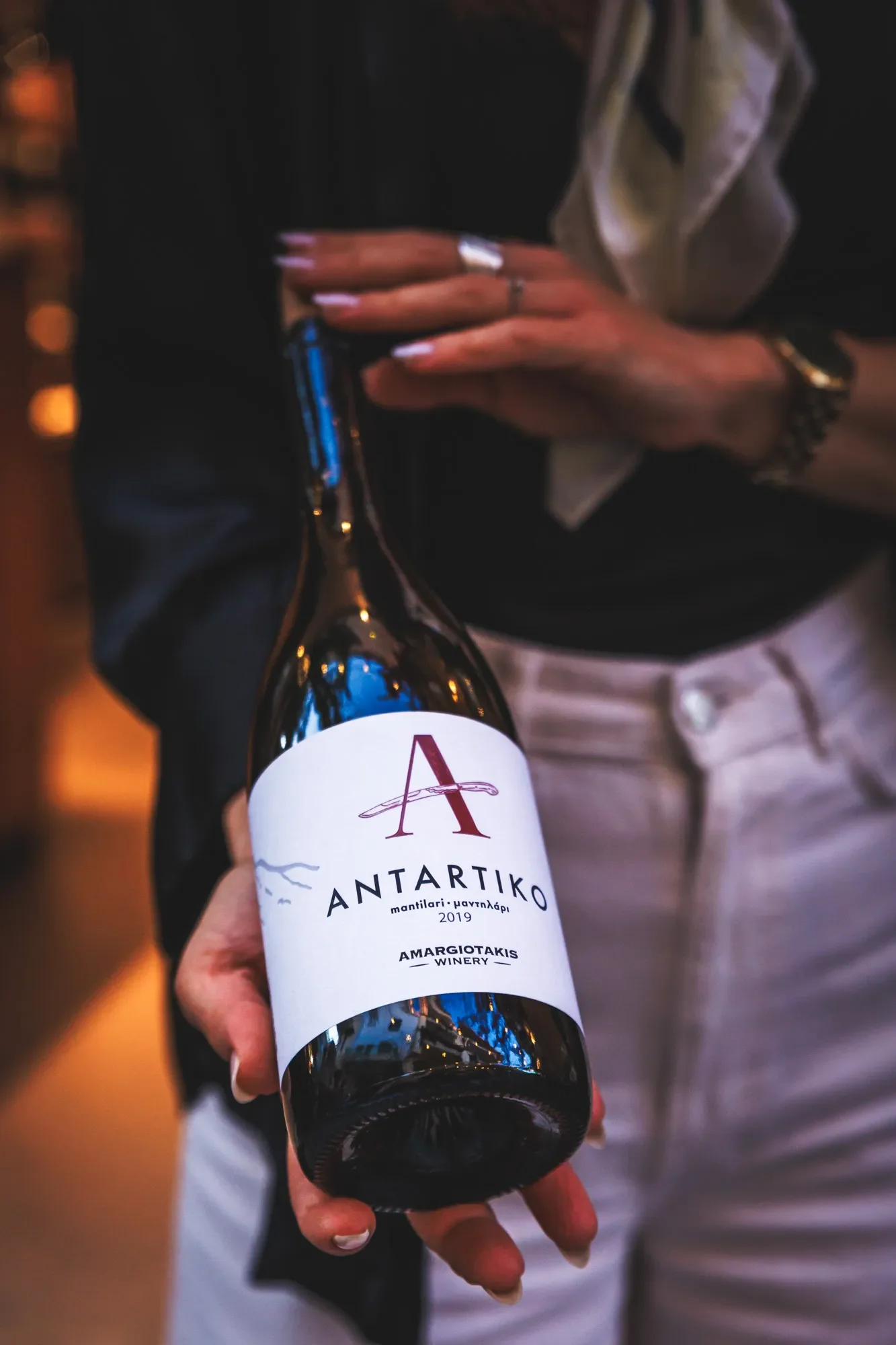 Presentation of a Mandilari wine bottle at a wine bar in the Old Town of Rethymno