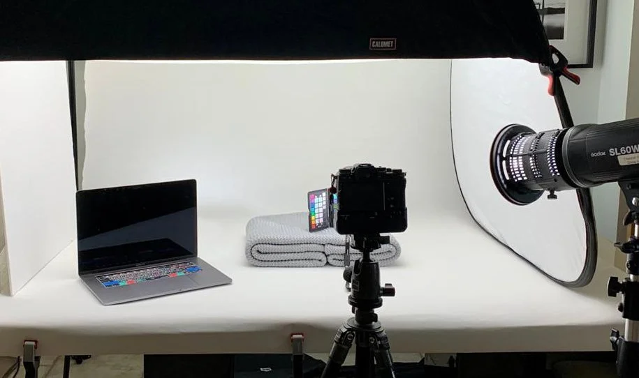 Tethered camera and studio lighting setup with a colour checker, used for commercial photography in Belfast