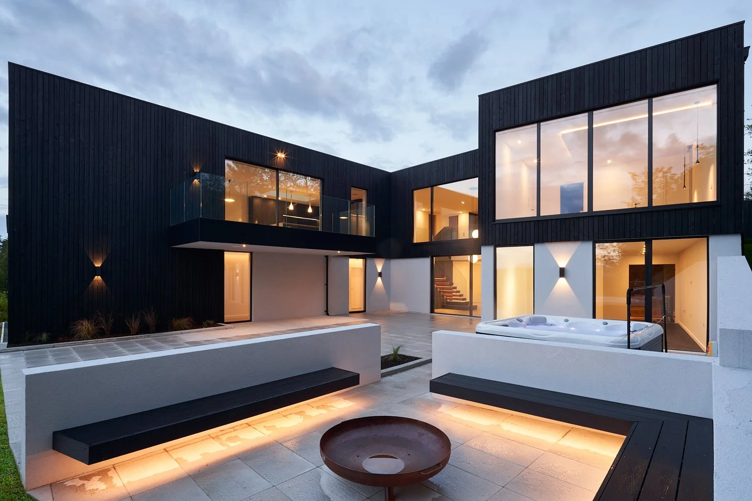 Rear patio area of newbuild home photographed in the evening - build home by FourSeven Homes, photographed by David Cordner.