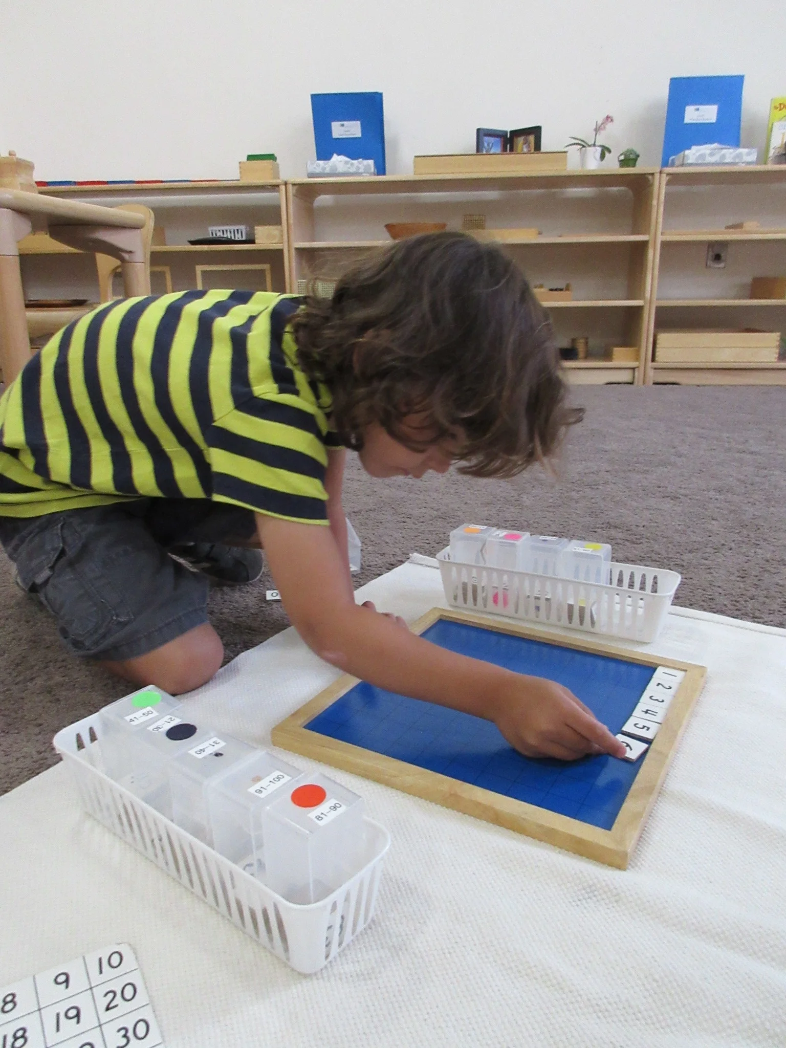 Child using the hundred board