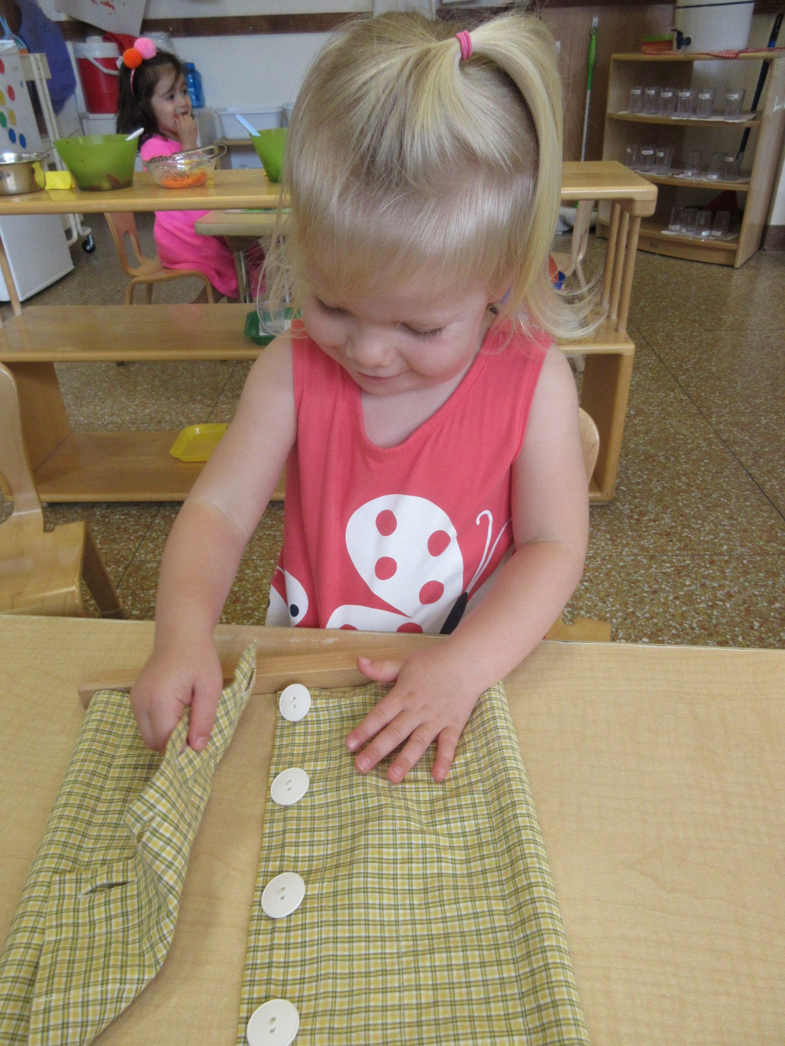 Working with the Practical Life Buttoning Frame