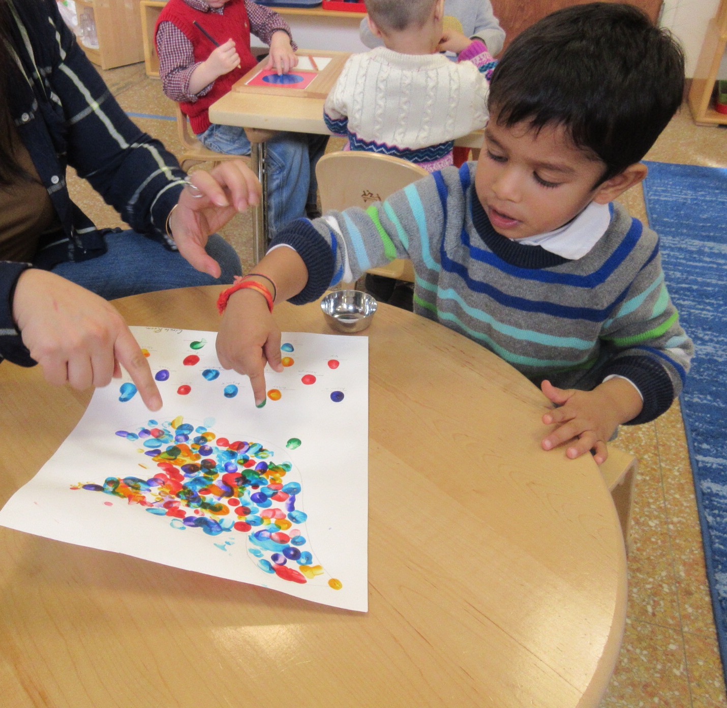 In Art class, we put fingerprints on our peace doves in honor of Dr. Martin Luther King Jr. Day