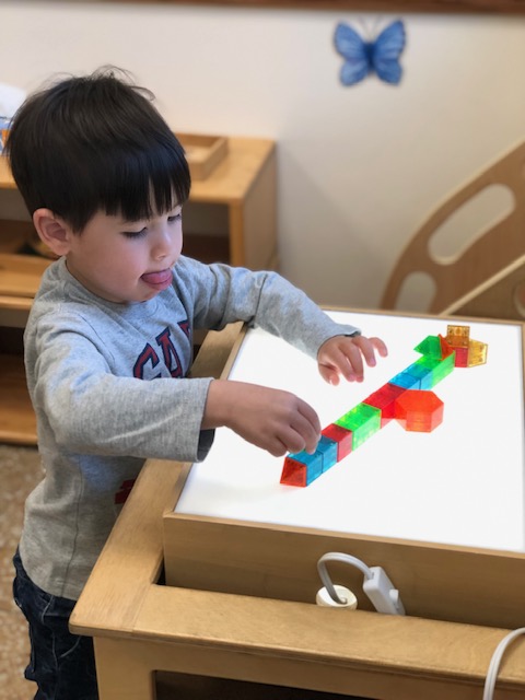 Magnetic geometric solids lit up on the light table