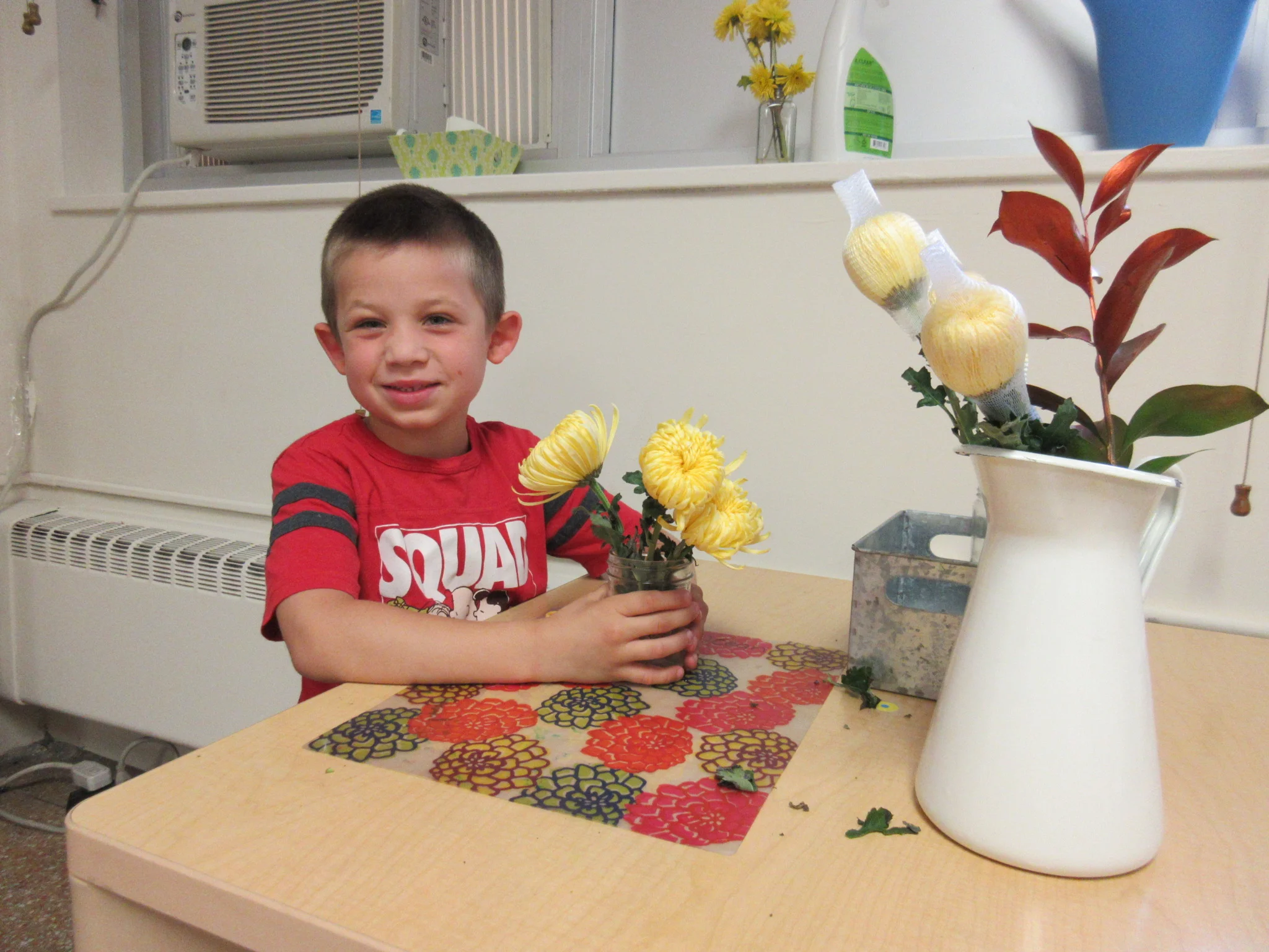 Arranging flowers to brighten the classroom!