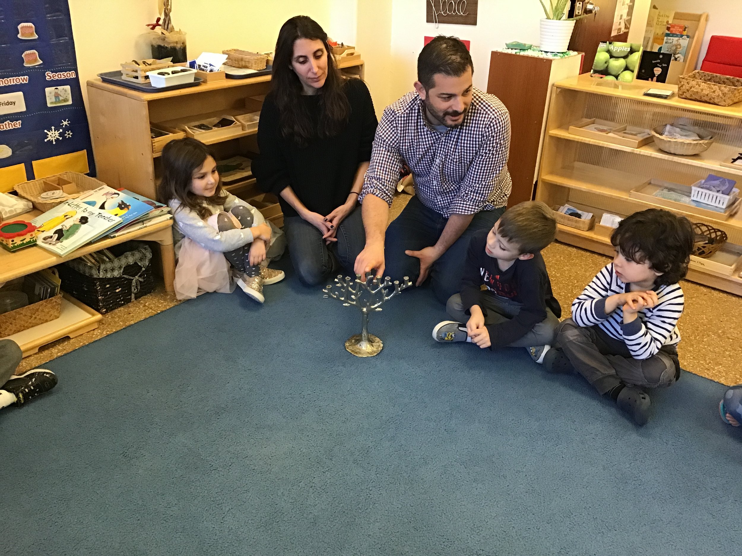 Learning about the Menorah during a Hanukkah presentation