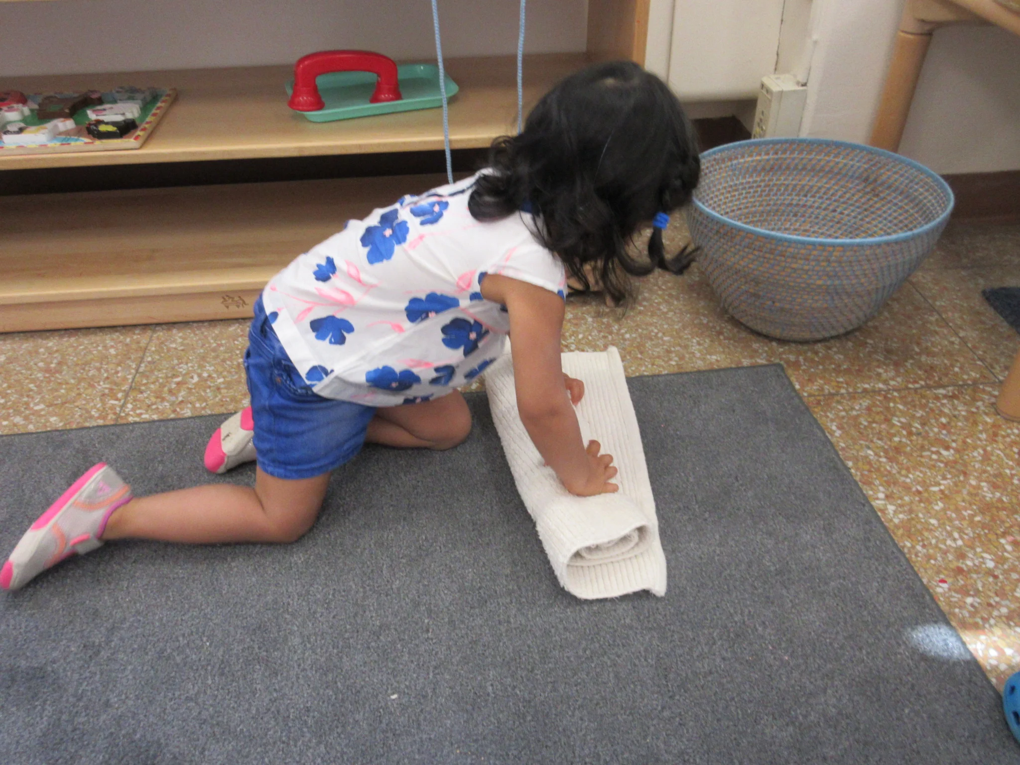 Practicing rolling up the work rug