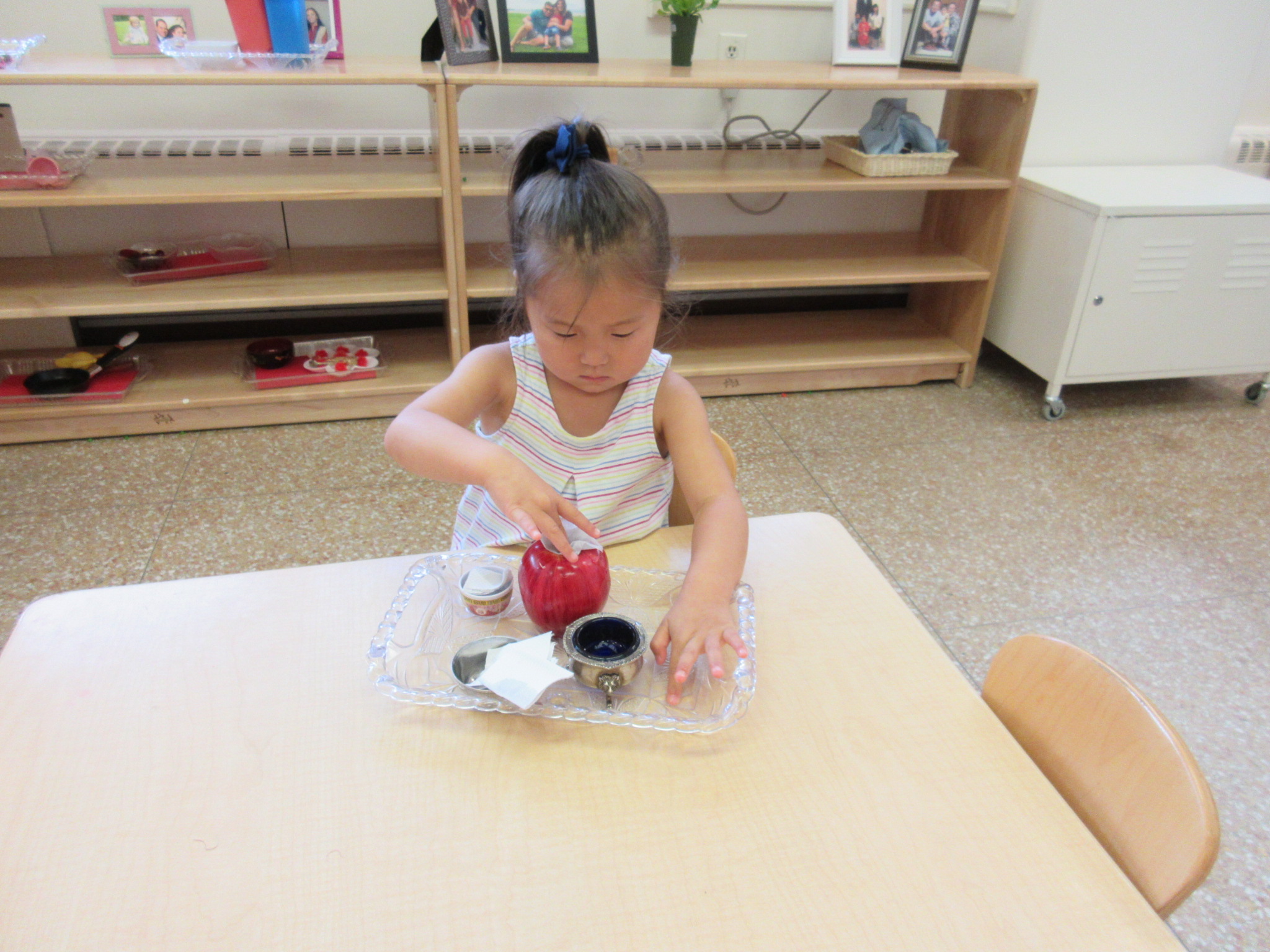 Apple washing with water and a paper towel 