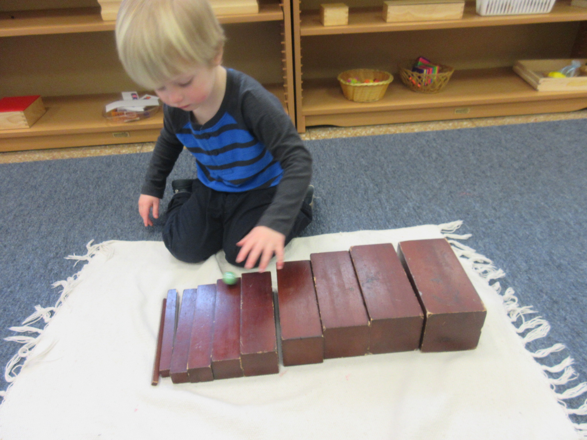 Placing the brown stairs is order from largest to smallest and then putting a marble down the stairs to see if they are in descending order 