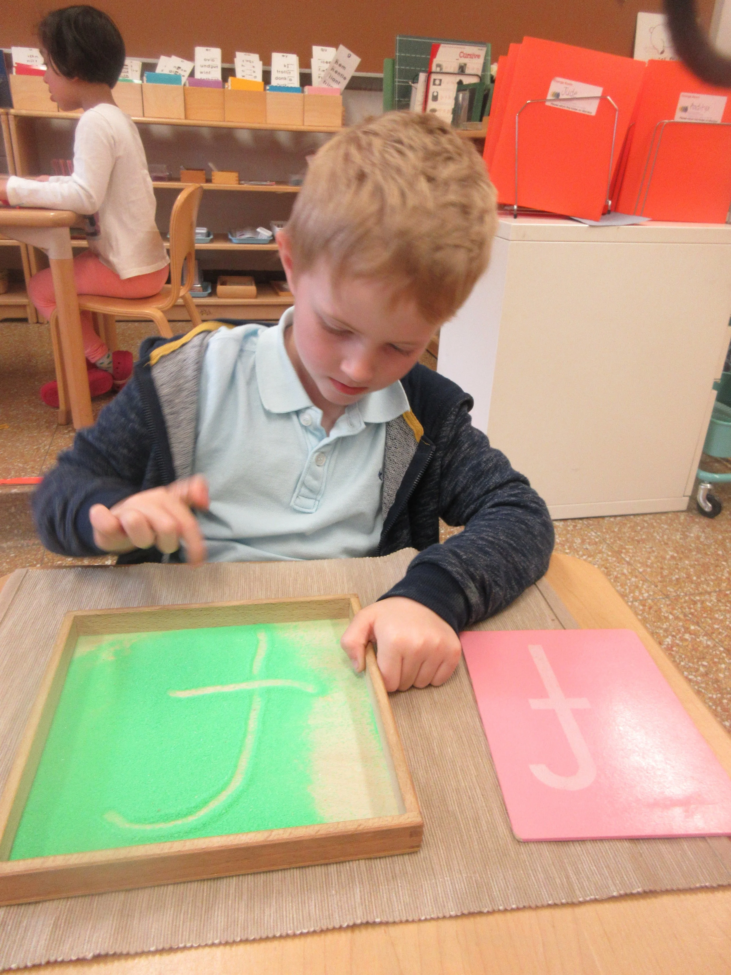 Working on handwriting using a sand tray! 